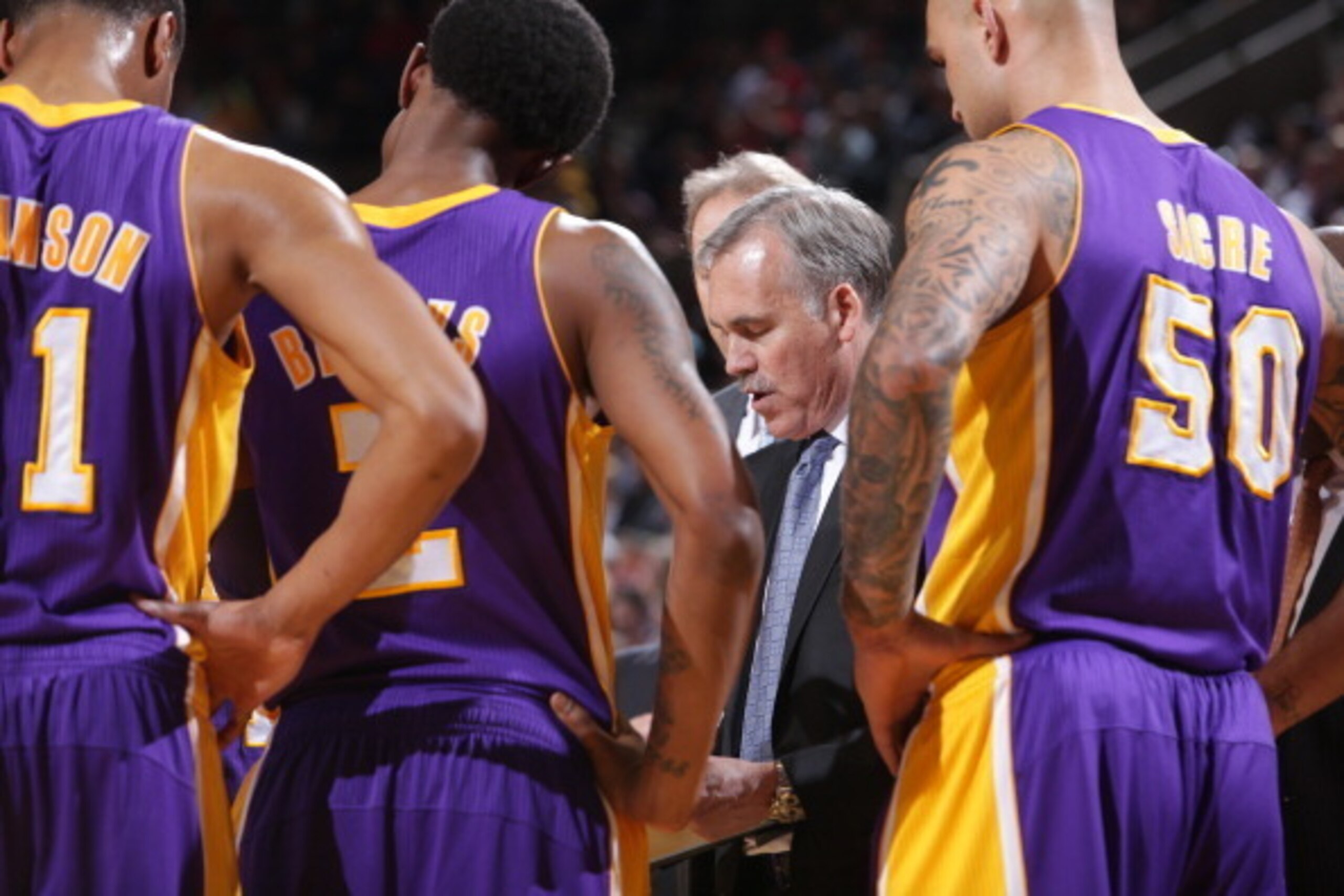 PORTLAND, OR - MARCH 3:  Mike D'Antoni of the Los Angeles Lakers draws up plays against the Portland Trail Blazers on March 3, 2014 at the Moda Center Arena in Portland, Oregon. NOTE TO USER: User expressly acknowledges and agrees that, by downloading and