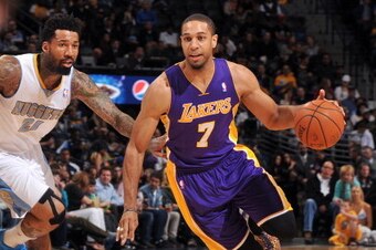 DENVER, CO - March 7: Xavier Henry #7 of the Los Angeles Lakers handles the ball against the Denver Nuggets on March 7, 2014 at the Pepsi Center in Denver, Colorado. NOTE TO USER: User expressly acknowledges and agrees that, by downloading and/or using th