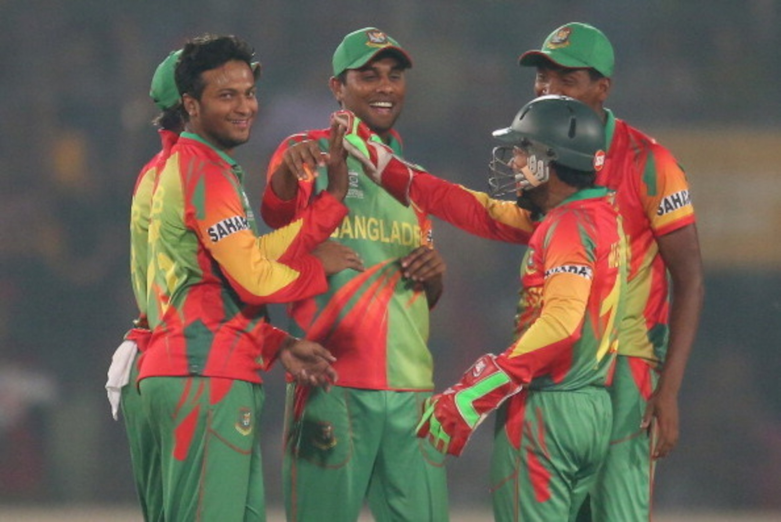DHAKA, BANGLADESH - MARCH 25:  Shakib Al Hasan and Mushfiqur Rahim of Bangladesh celebrate after dismissing Lendl Simmons of the West Indies during the ICC World Twenty20 Bangladesh 2014 match between Bangladesh and the West Indies at Sher-e-Bangla Mirpur