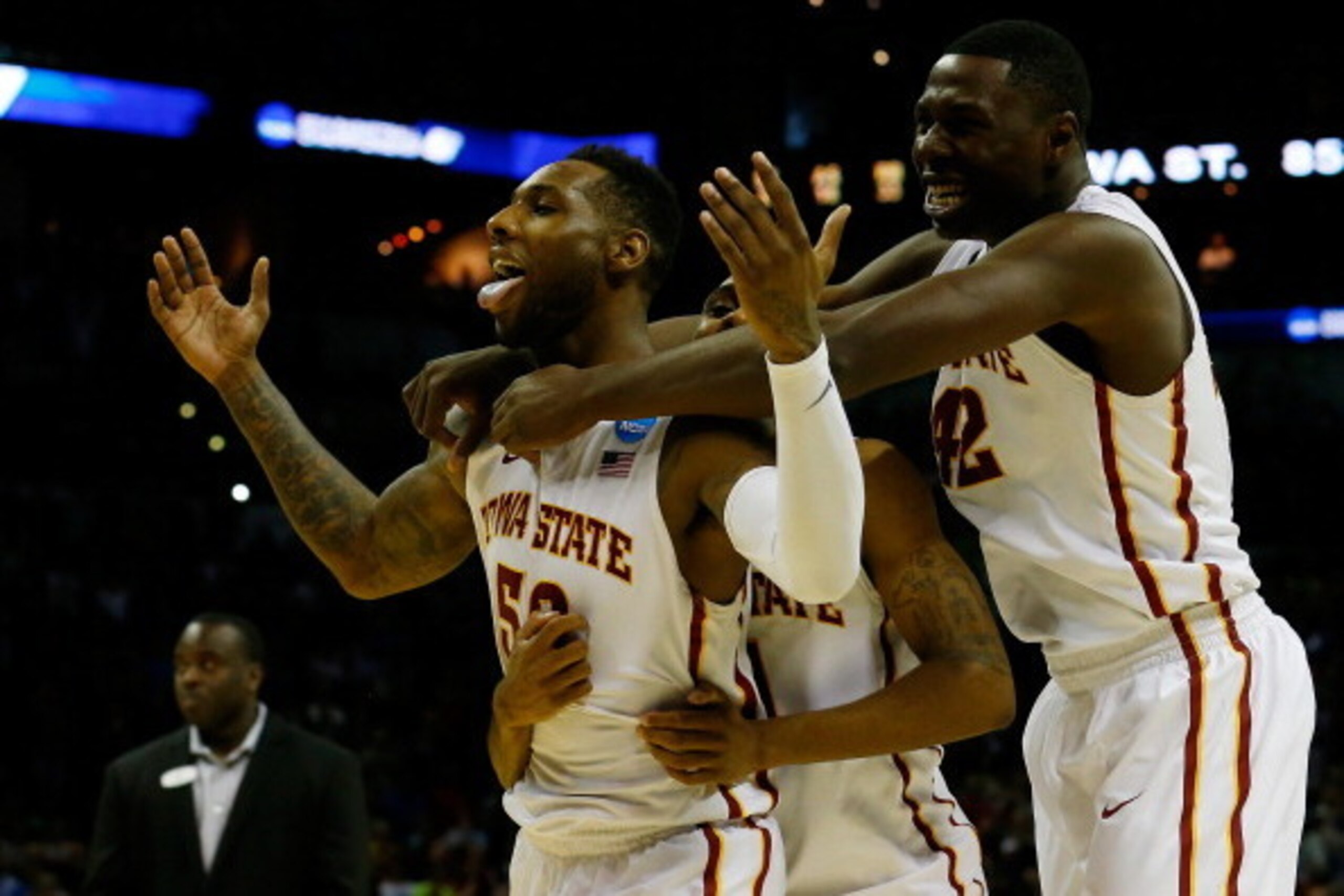 SAN ANTONIO, TX - MARCH 23:  DeAndre Kane #50, Monte Morris #11 and Daniel Edozie #42 of the Iowa State Cyclones celebrate after defeating the North Carolina Tar Heels 85-83 in the third round of the 2014 NCAA Men's Basketball Tournament at the AT&T Cente