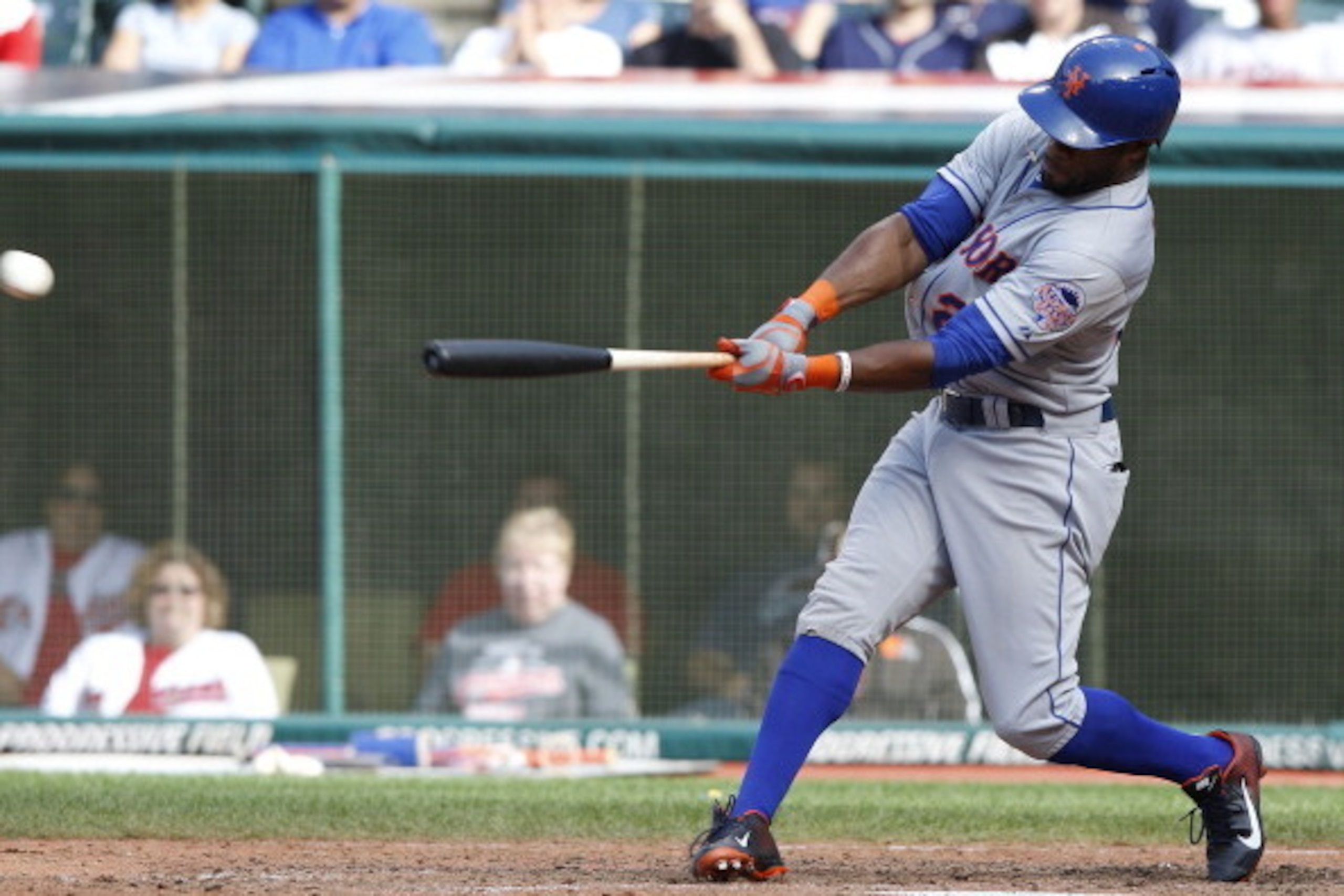 CLEVELAND, OH - SEPTEMBER 8:  Eric Young #22 of the New York Mets hits an RBI double to score teammate Matt den Dekker #6 during the ninth inning against the Cleveland Indians in their game on September 8, 2013 at Progressive Field in Cleveland, Ohio.  Th