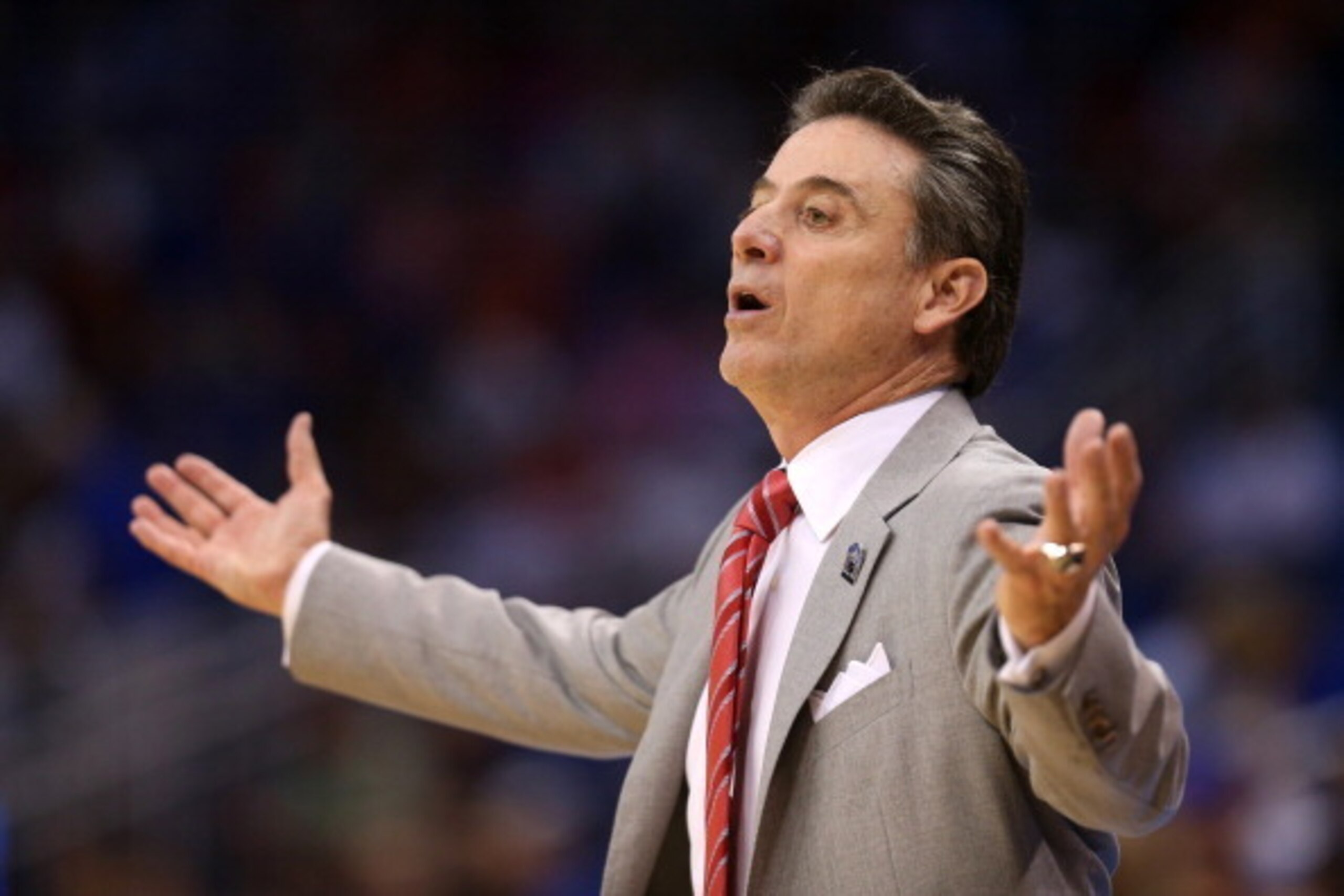 ORLANDO, FL - MARCH 22:  Head coach Rick Pitino of the Louisville Cardinals looks on in the first half while taking on the Saint Louis Billikens during the third round of the 2014 NCAA Men's Basketball Tournament at Amway Center on March 22, 2014 in Orlan