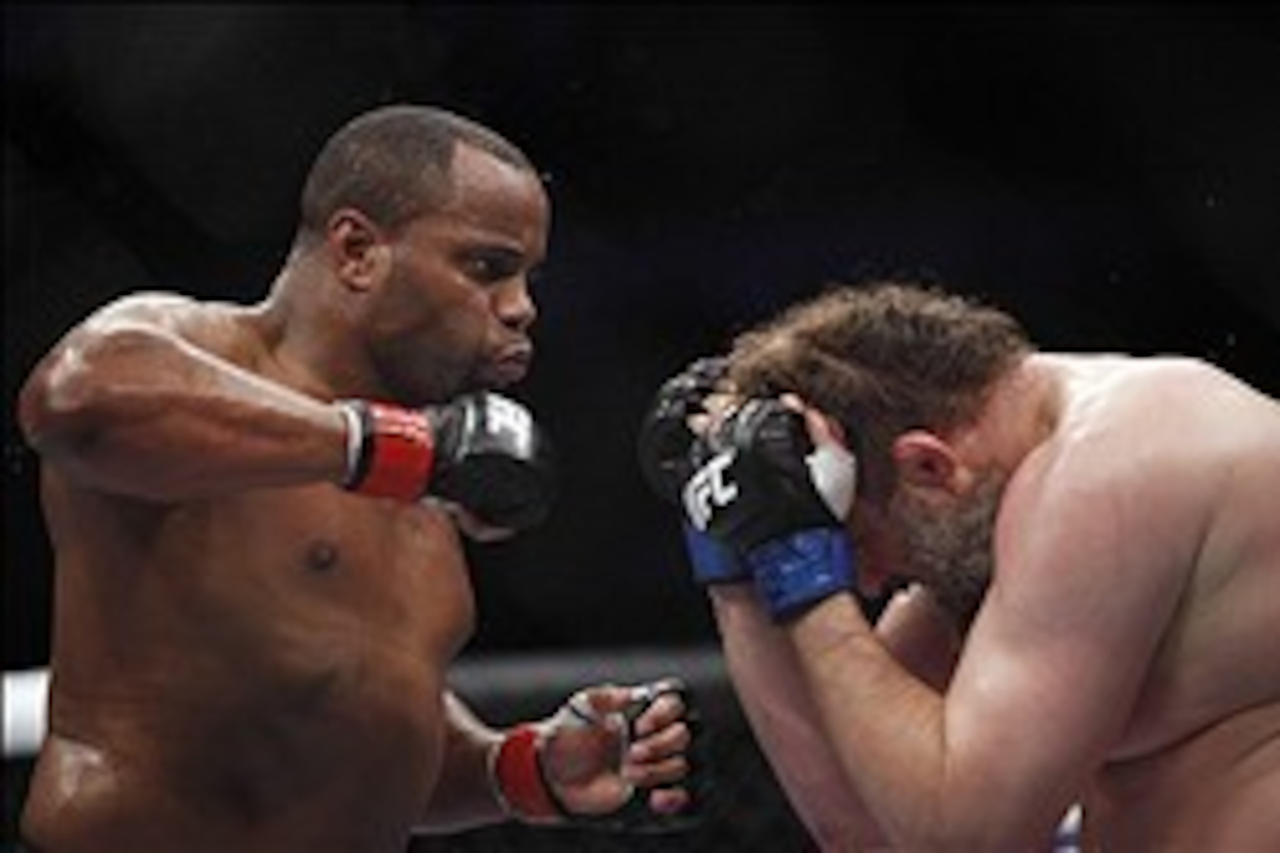 Oct 19, 2013; Houston, TX, USA; Daniel Cormier (red gloves) fights against Roy Nelson (blue gloves) in their heavyweight bout during UFC 166 at Toyota Center. Mandatory Credit: Andrew Richardson-USA TODAY Sports
