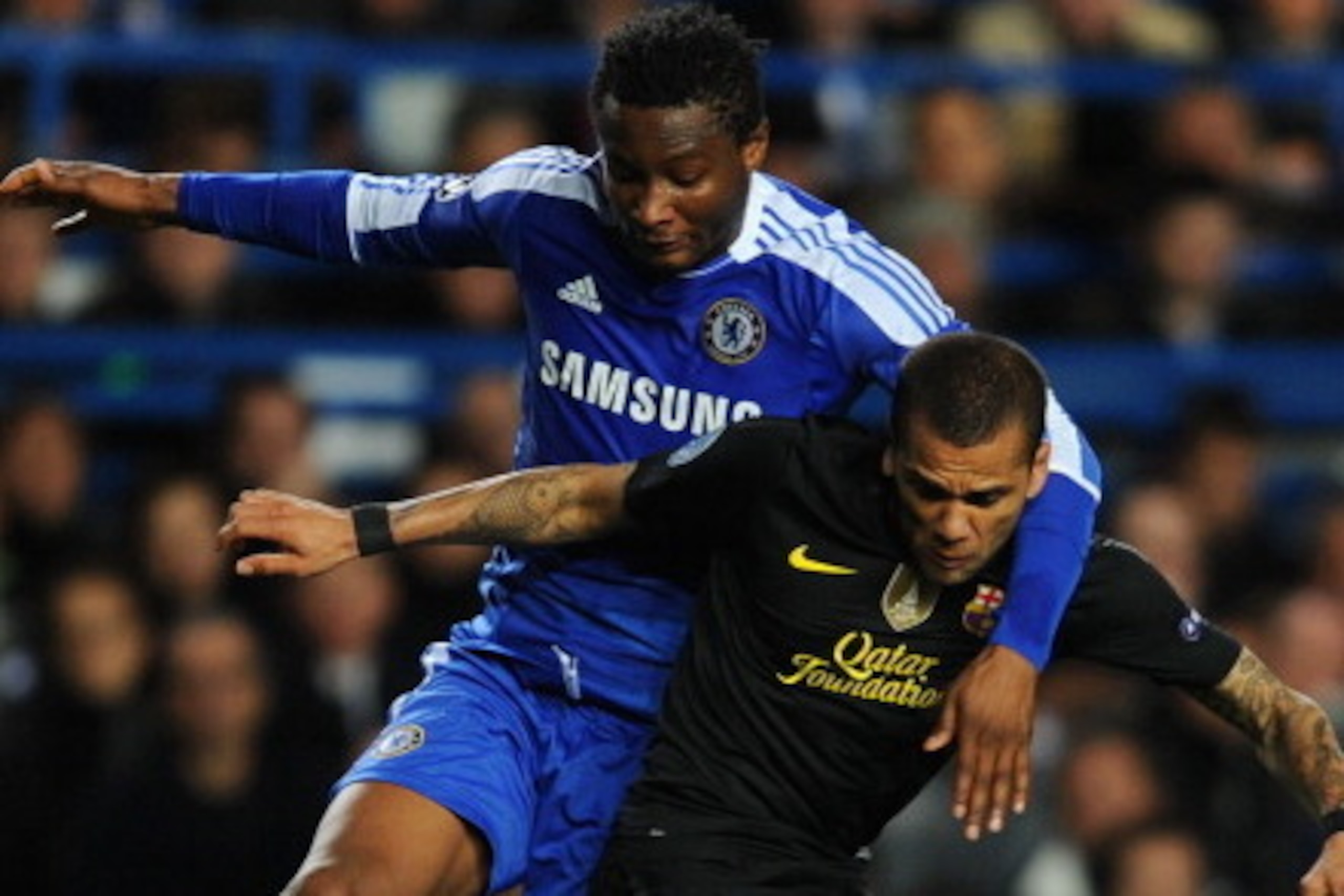 LONDON, ENGLAND - APRIL 18: Mikel of Chelsea challenges Daniel Alves of Barcelona during the UEFA Champions League Semi Final first leg match between Chelsea and Barcelona at Stamford Bridge on April 18, 2012 in London, England.  (Photo by Michael Regan/G