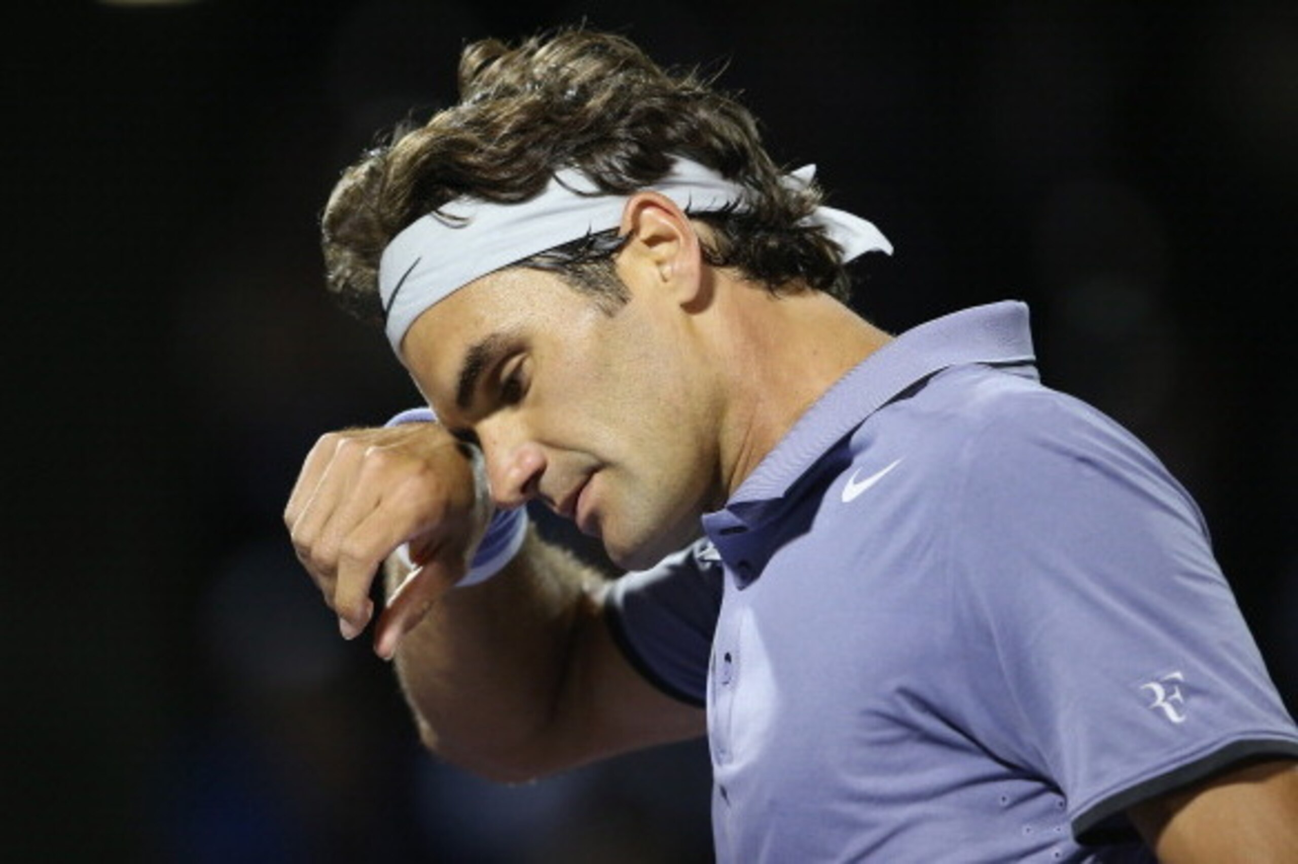 KEY BISCAYNE, FL - MARCH 26:  Roger Federer of Switzerland shows his dejection against Kei Nishikori of Japan during their quarter final round match during day 10 at the Sony Open at Crandon Park Tennis Center on March 26, 2014 in Key Biscayne, Florida.  