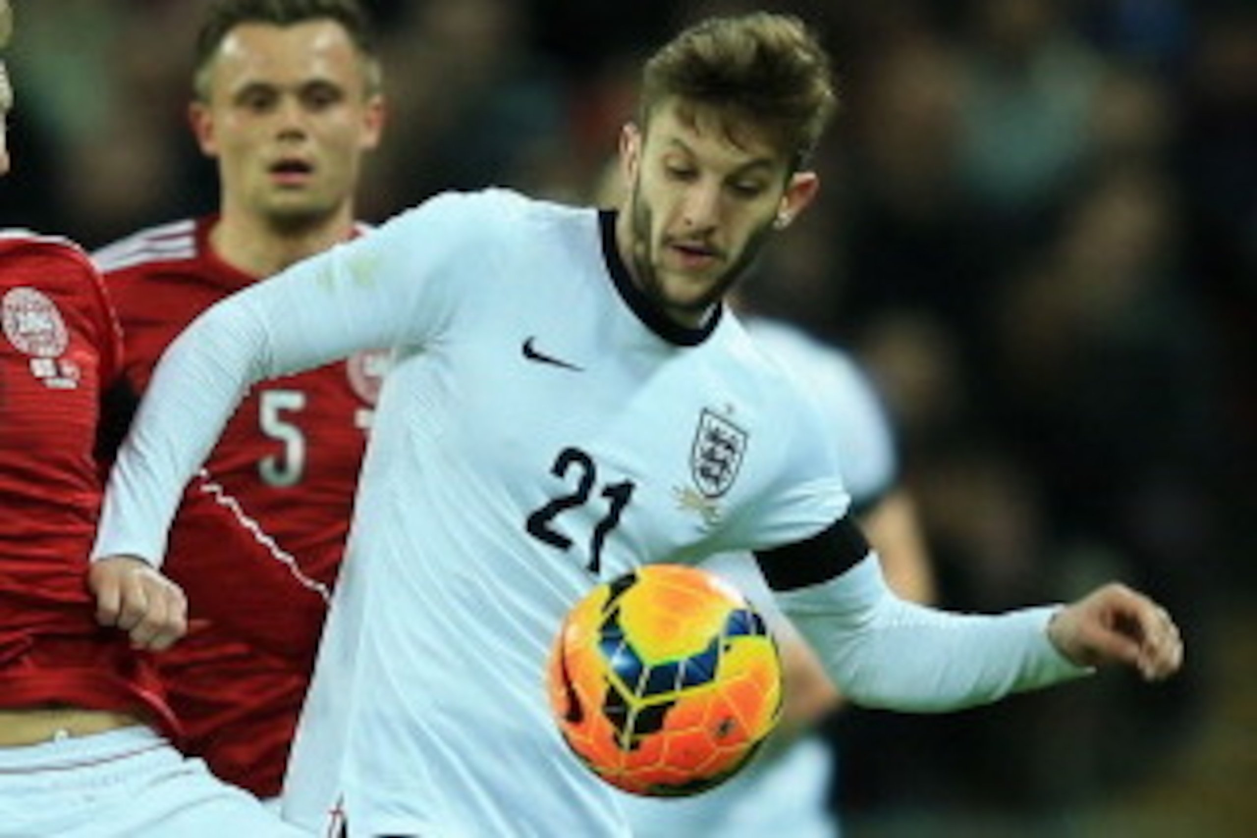 LONDON, ENGLAND - MARCH 05:  Adam Lallana of England challenges for the ball with Niki Zimling of Denmark during the International Friendly match between England and Denmark at Wembley Stadium on March 5, 2014 in London, England.  (Photo by Richard Heathc