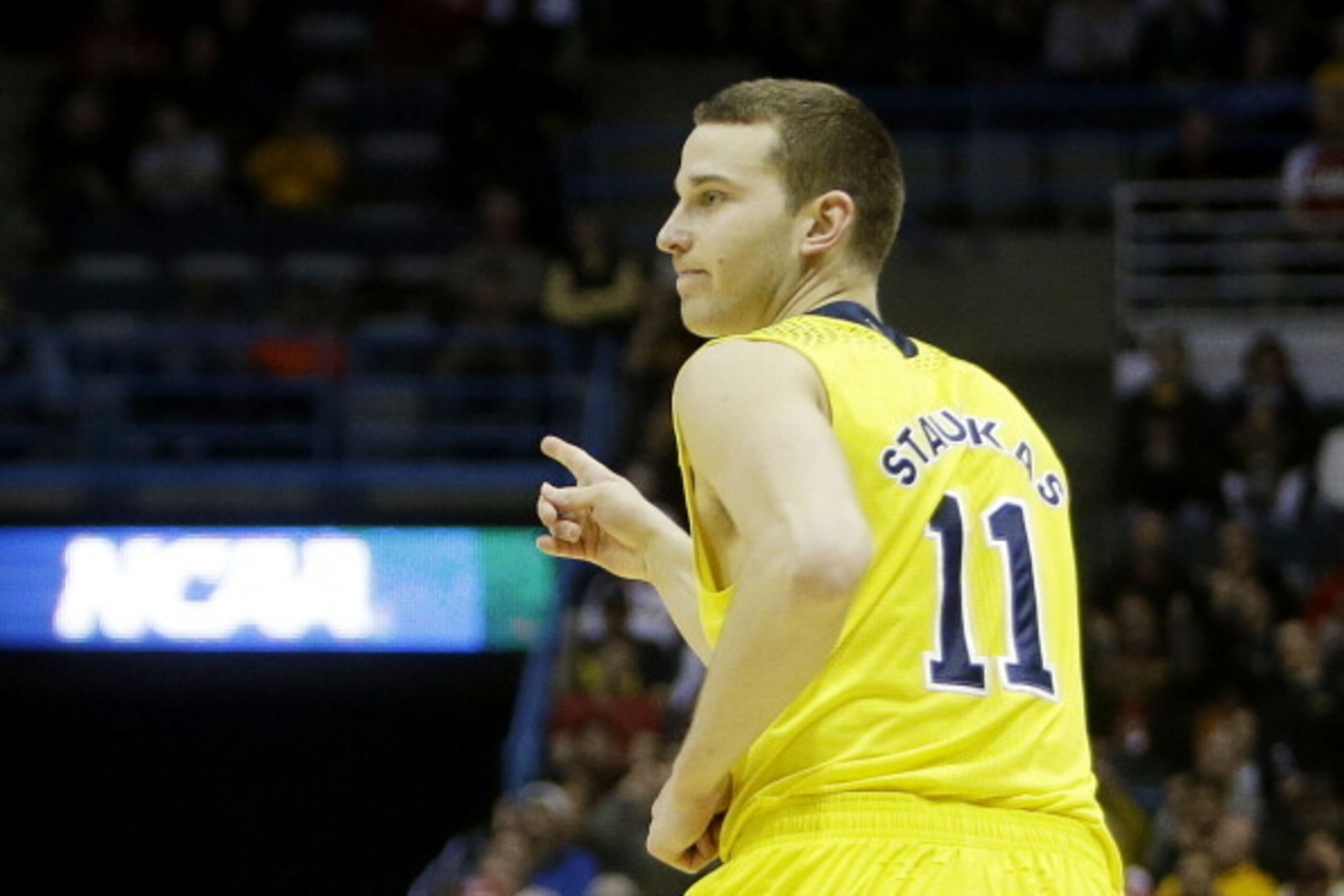 MILWAUKEE, WI - MARCH 20:  Nik Stauskas #11 of the Michigan Wolverines celebrates a three point shot in the second half during the second round of the 2014 NCAA Men's Basketball Tournament at BMO Harris Bradley Center on March 20, 2014 in Milwaukee, Wisco