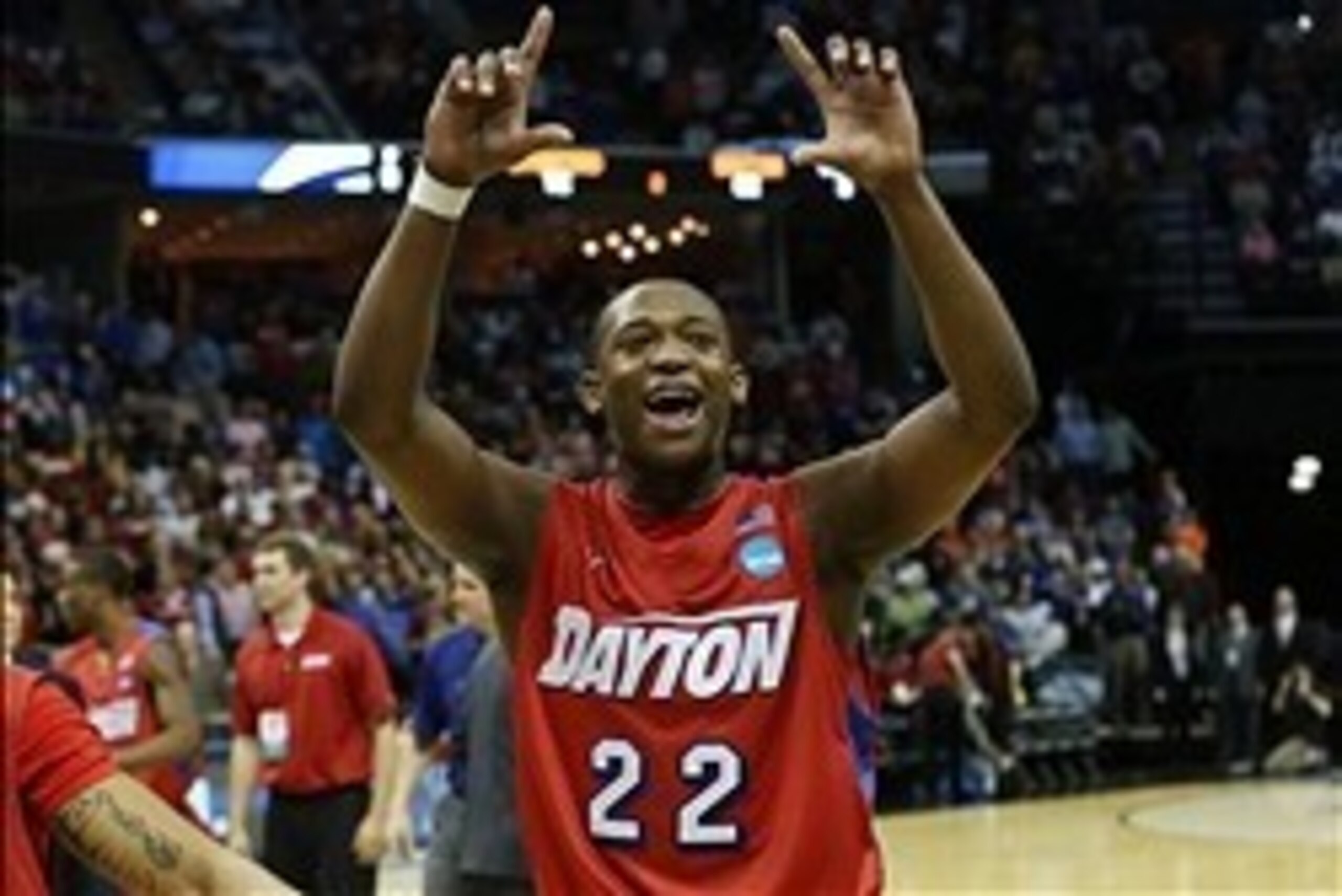 Mar 27, 2014; Memphis, TN, USA; Dayton Flyers forward Kendall Pollard (22) celebrates after defeating the Stanford Cardinal 82-72 in the semifinals of the south regional of the 2014 NCAA Mens Basketball Championship tournament at FedExForum. Mandatory Cre