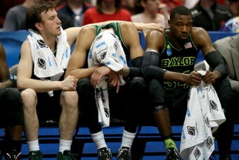 ANAHEIM, CA - MARCH 27:  Brady Heslip #5, Isaiah Austin #21 and Cory Jefferson #34 of the Baylor Bears sit on the bench late in the second half while taking on the Wisconsin Badgers during the regional semifinal of the 2014 NCAA Men's Basketball Tournamen