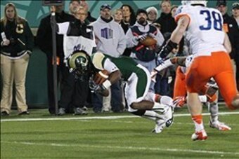 Nov 2, 2013; Fort Collins, CO, USA; Colorado State Rams wide receiver Charles Lovett (4) scores a touchdown against Boise State Broncos cornerback Donte Deayon (5) and linebacker Corey Bell (38) during the second quarter at Hughes Stadium. Mandatory Credi