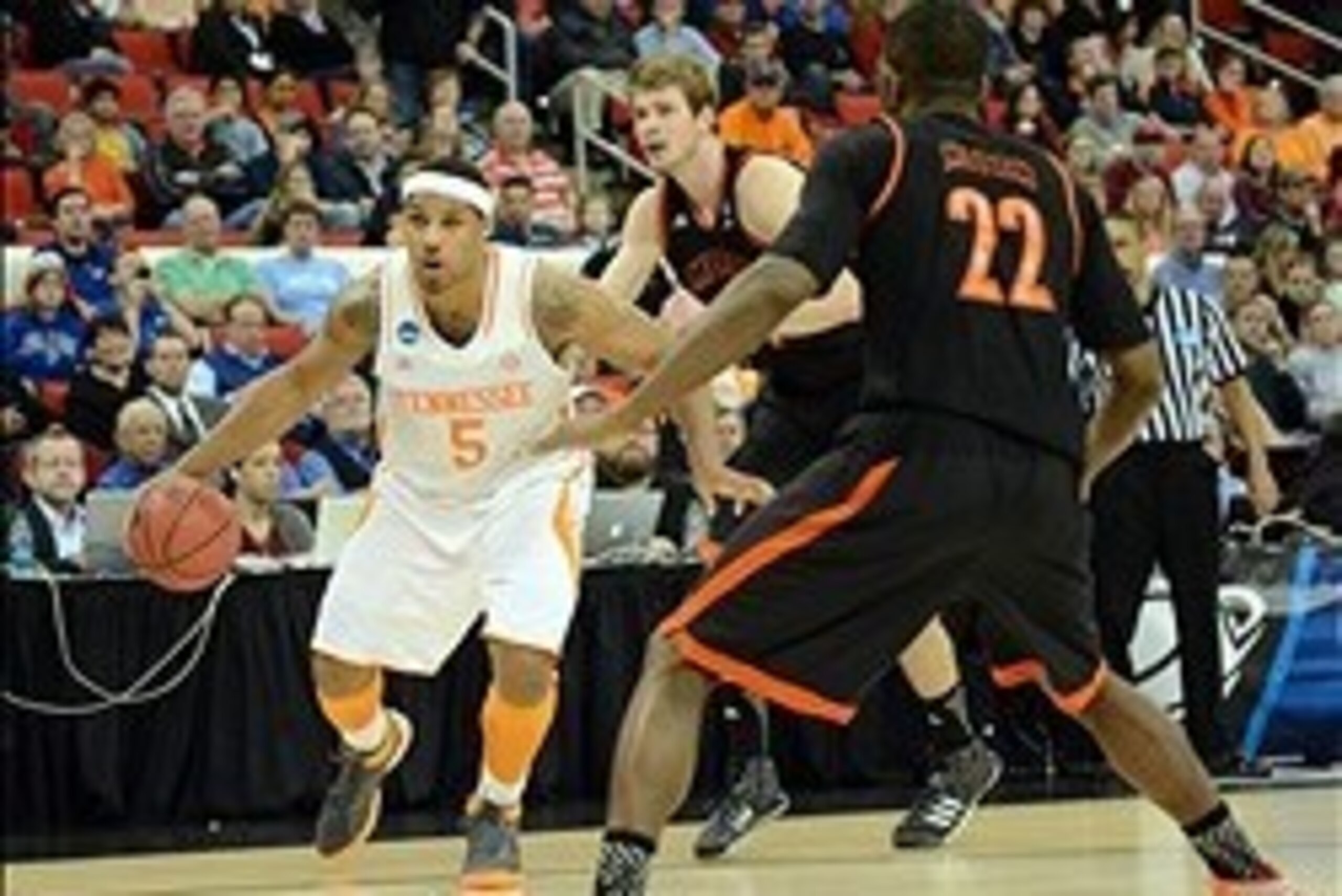 Mar 23, 2014; Raleigh, NC, USA; Tennessee Volunteers forward Jarnell Stokes (5) drives to the basket against Mercer Bears forward Darious Moten (22) during the second half of a men's college basketball game during the third round of the 2014 NCAA Tourname Mar 23, 2014; Raleigh, NC, USA; Tennessee Volunteers forward Jarnell Stokes (5) drives to the basket against Mercer Bears forward Darious Moten (22) during the second half of a men's college basketball game during the third round of the 2014 NCAA Tourname