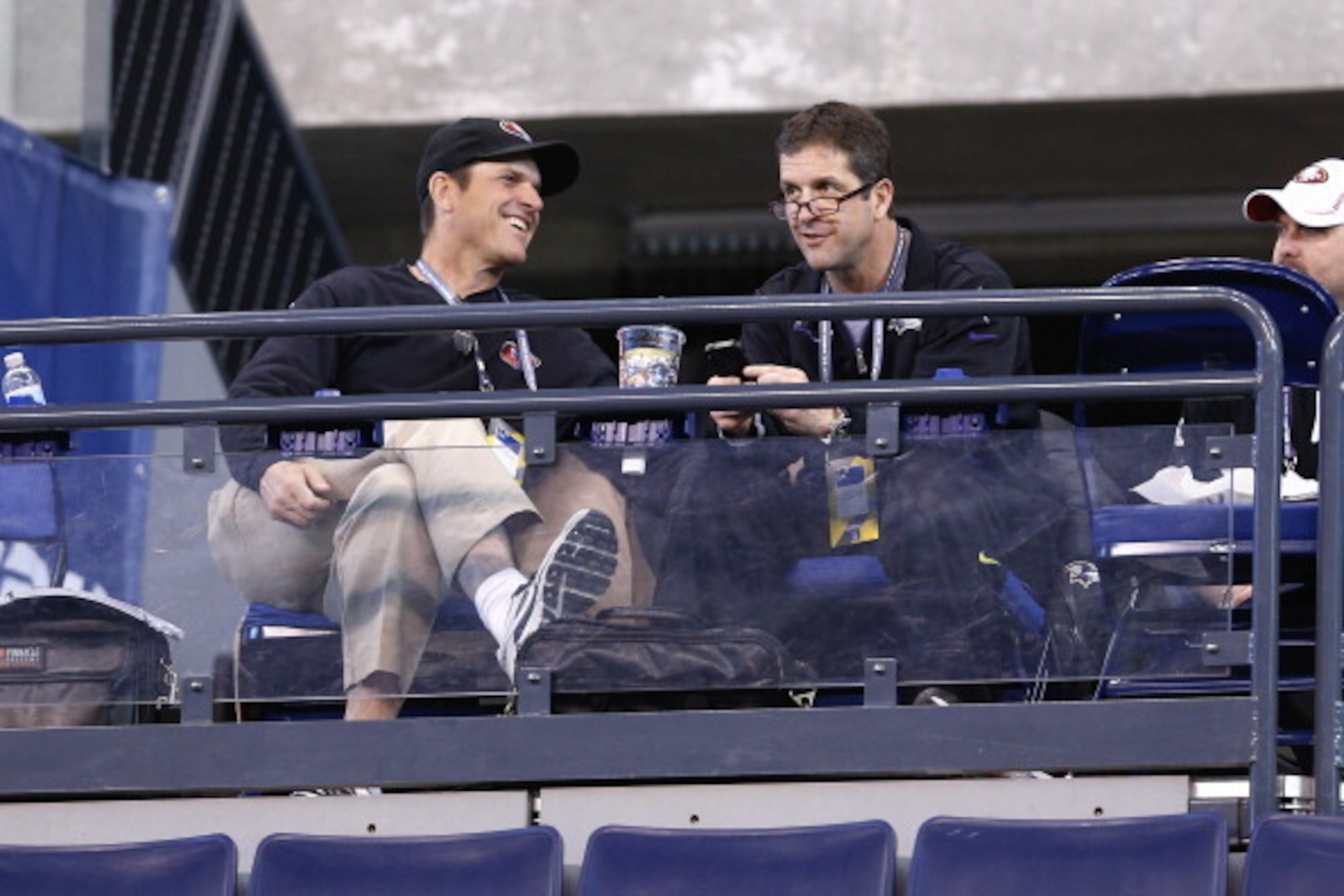 INDIANAPOLIS, IN - FEBRUARY 23: San Francisco 49ers head coach Jim Harbaugh (left) and Baltimore Ravens head coach John Harbaugh (right) look on during the 2013 NFL Combine at Lucas Oil Stadium on February 23, 2013 in Indianapolis, Indiana. (Photo by Joe 