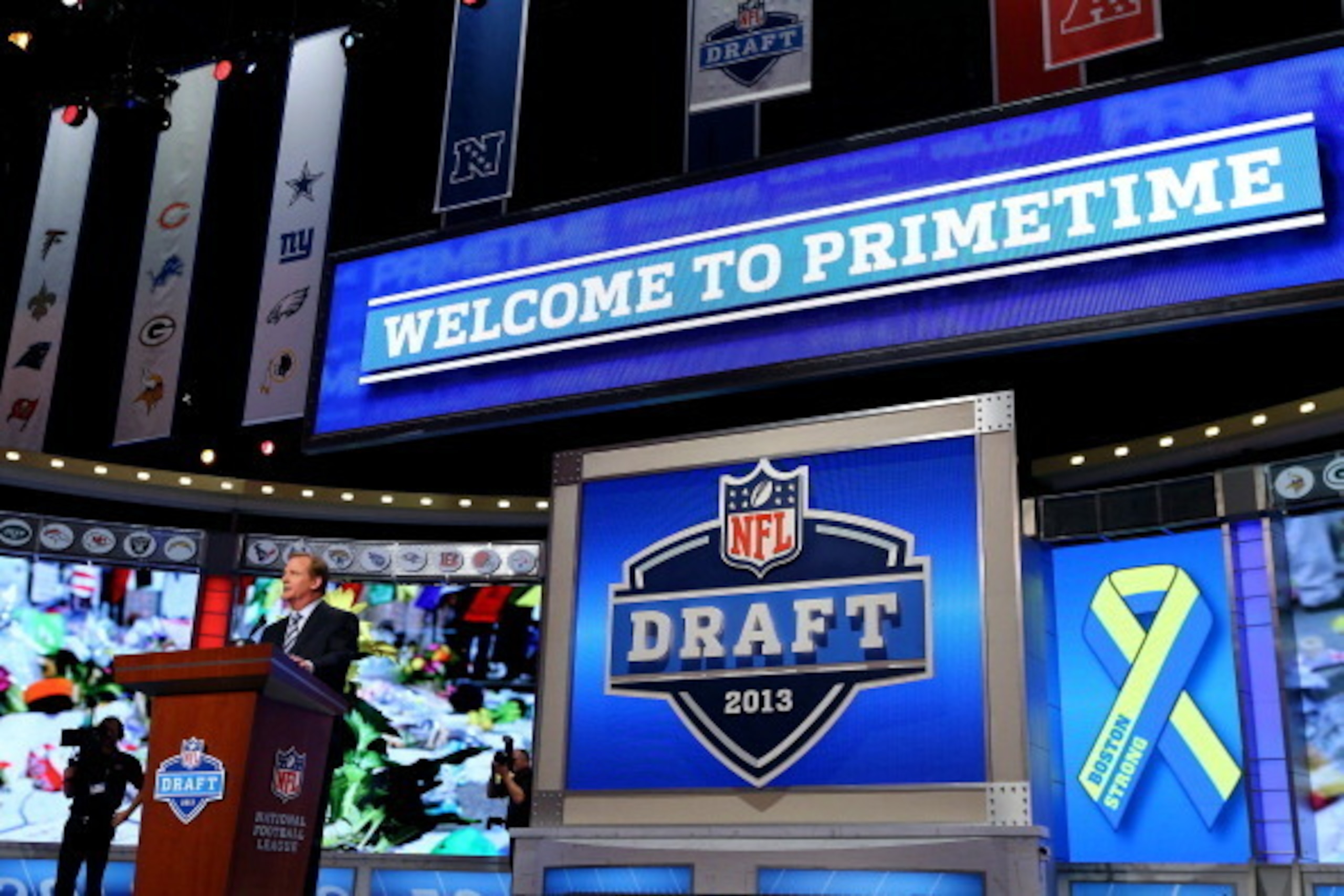 NEW YORK, NY - APRIL 25:  NFL Commissioner Roger Goodell stands at the podium during a moment of silence for the victims and those others affected by the Bombing at the Boston Marathon in the first round of the 2013 NFL Draft at Radio City Music Hall on A