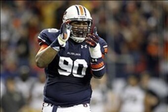 Dec 7, 2013; Atlanta, GA, USA; Auburn Tigers defensive lineman Gabe Wright (90) reacts during the first quarter of the 2013 SEC Championship game against the Missouri Tigers at Georgia Dome. Mandatory Credit: Brett Davis-USA TODAY Sports Dec 7, 2013; Atlanta, GA, USA; Auburn Tigers defensive lineman Gabe Wright (90) reacts during the first quarter of the 2013 SEC Championship game against the Missouri Tigers at Georgia Dome. Mandatory Credit: Brett Davis-USA TODAY Sports