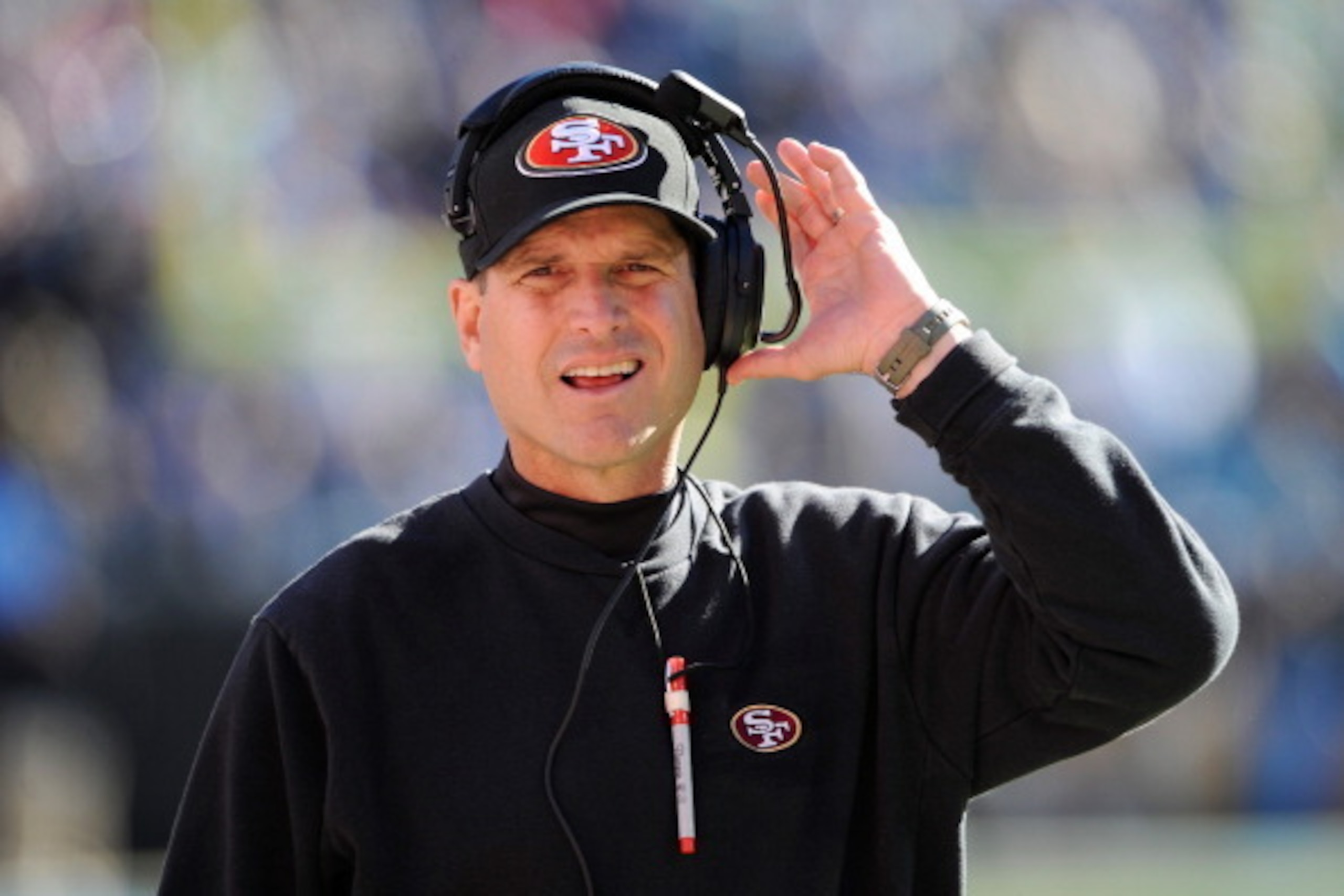 CHARLOTTE, NC - JANUARY 12: Head coach Jim Harbaugh of the San Francisco 49ers looks ok from the sideline in the second quarter against the Carolina Panthers during the NFC Divisional Playoff Game at Bank of America Stadium on January 12, 2014 in Charlott