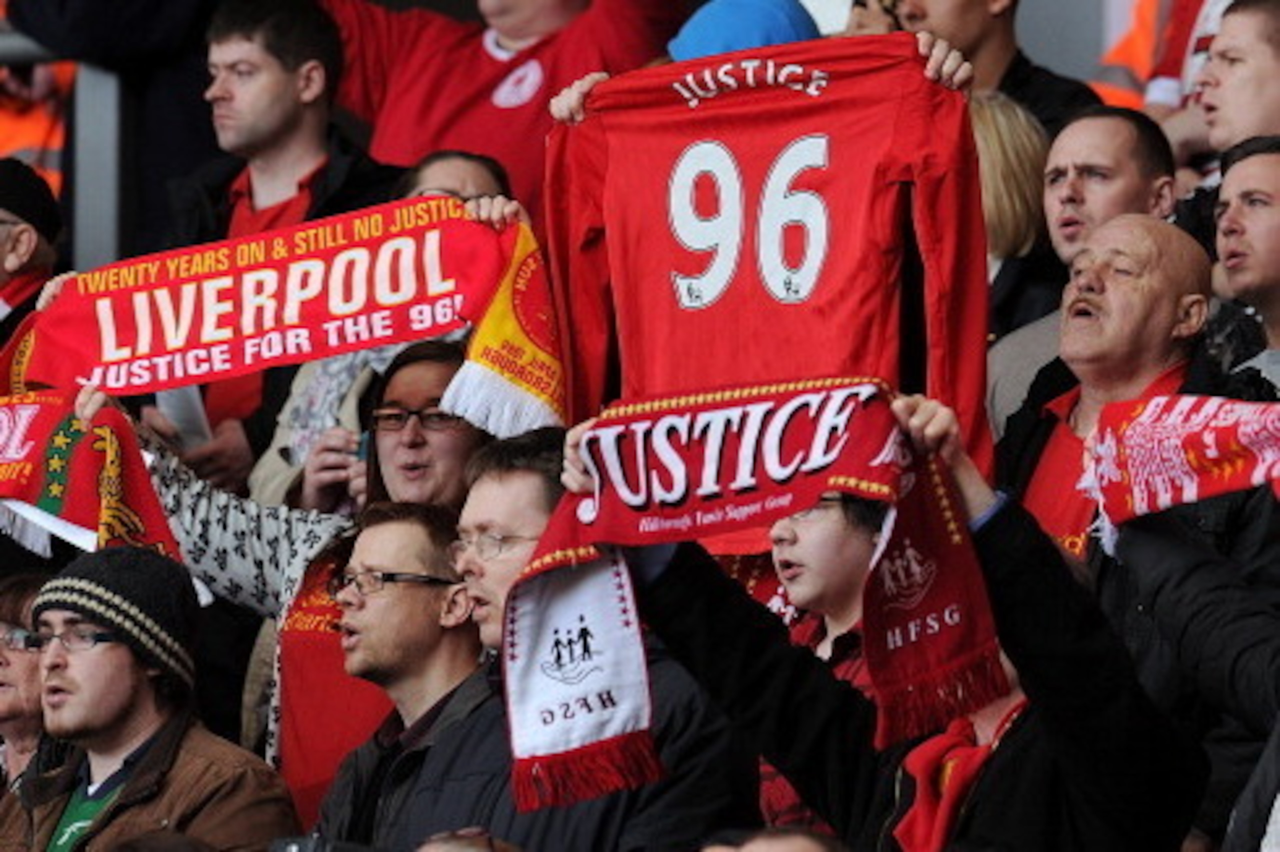 LIVERPOOL, ENGLAND - APRIL 15:  (THE SUN OUT, THE SUN ON SUNDAY OUT) (NO SALES)  In this handout image provided by Liverpool FC, supporters hold scarves and shirts aloft in memory of the victims during the 24th Hillsborough Anniversary Memorial Service at