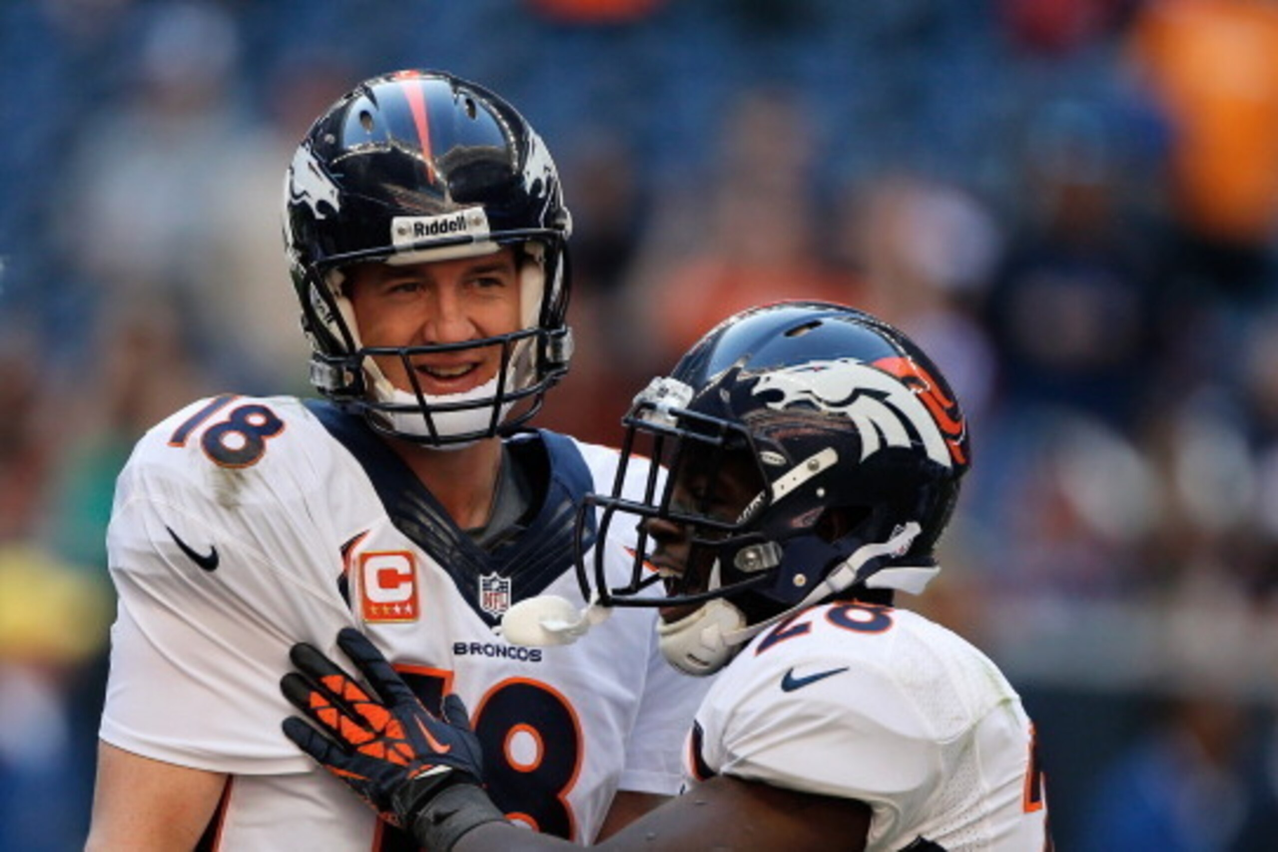 HOUSTON, TX - DECEMBER 22:  Peyton Manning #18 of the Denver Broncos celebrates with Montee Ball #28 after Manning set the NFL record for touchdown passes in a season with 51, in a 37-13 defeat of the Houston Texans at Reliant Stadium on December 22, 2013
