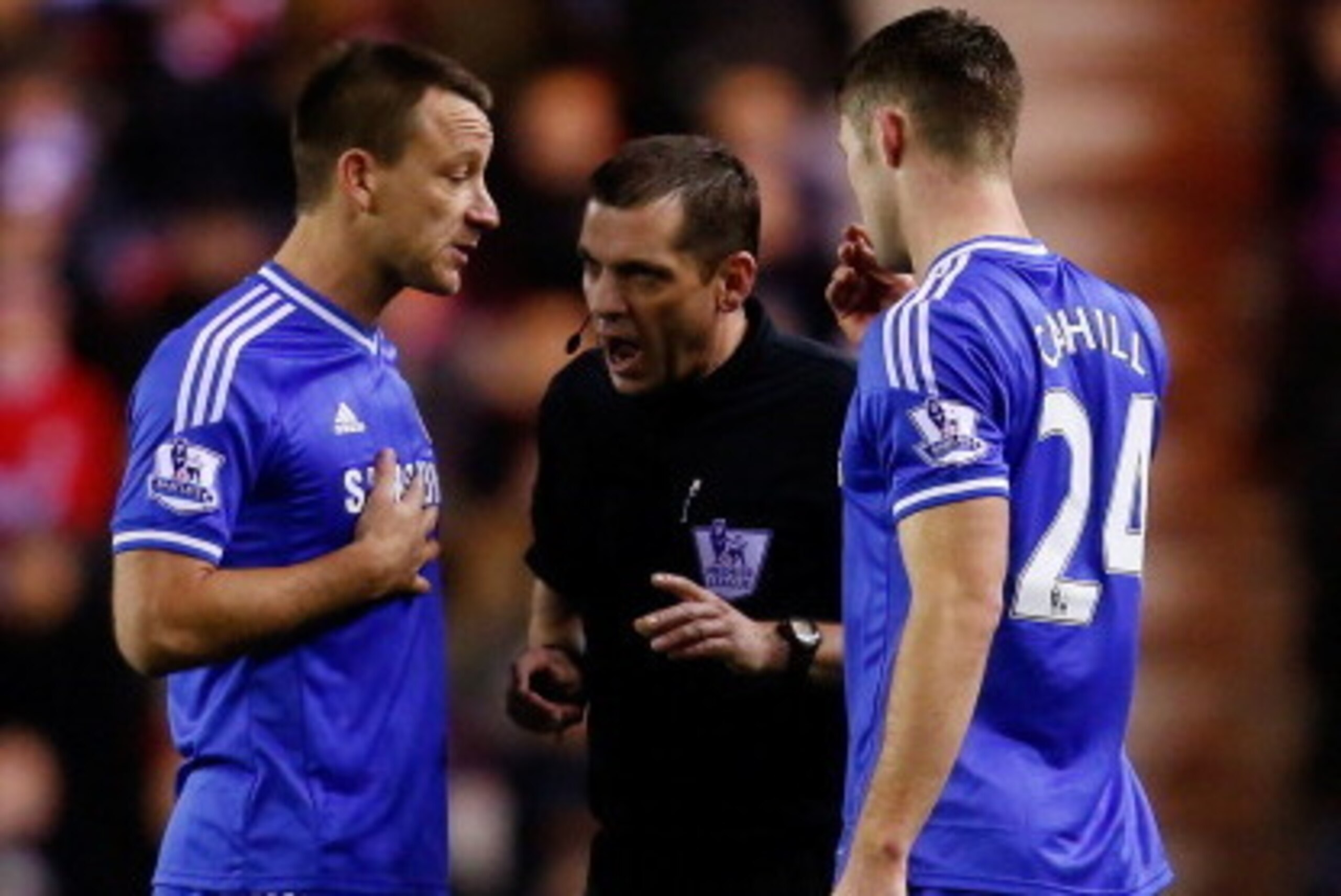 SUNDERLAND, ENGLAND - DECEMBER 04: Referee Phil Dowd (C) has words with John Terry (L) and Gary Cahill of Chelsea during the Barclays Premier League match between Sunderland and Chelsea at the Stadium of Light on December 4, 2013 in Sunderland, England. (