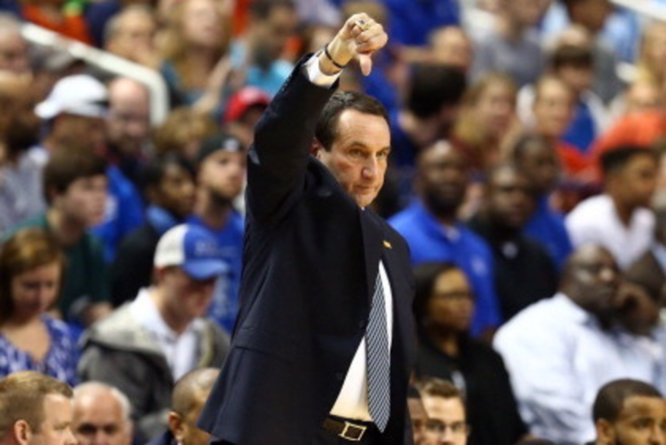 GREENSBORO, NC - MARCH 16:  Duke Blue Devils head coach Mike Krzyzewski singles to his team's game against the Virginia Cavaliers during the finals of the 2014 Men's ACC Basketball Tournament at Greensboro Coliseum on March 16, 2014 in Greensboro, North C