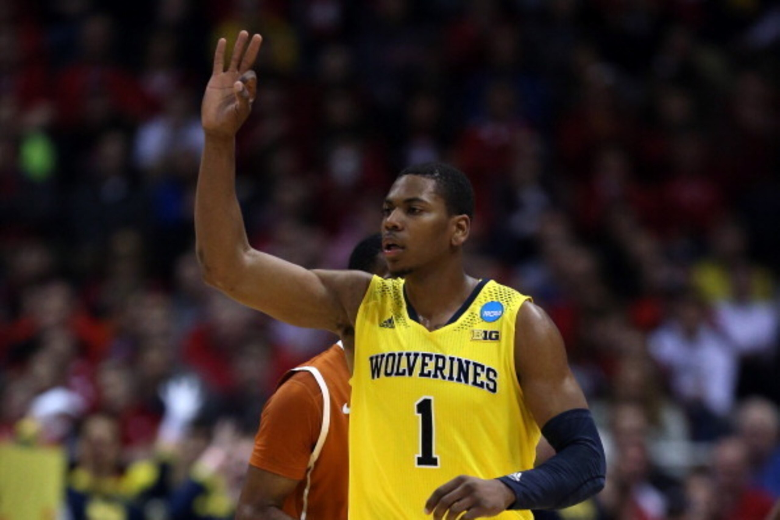 MILWAUKEE, WI - MARCH 22:  Glenn Robinson III #1 of the Michigan Wolverines celebrates a three point shot in the second half against the Texas Longhorns during the third round of the 2014 NCAA Men's Basketball Tournament at BMO Harris Bradley Center on Ma