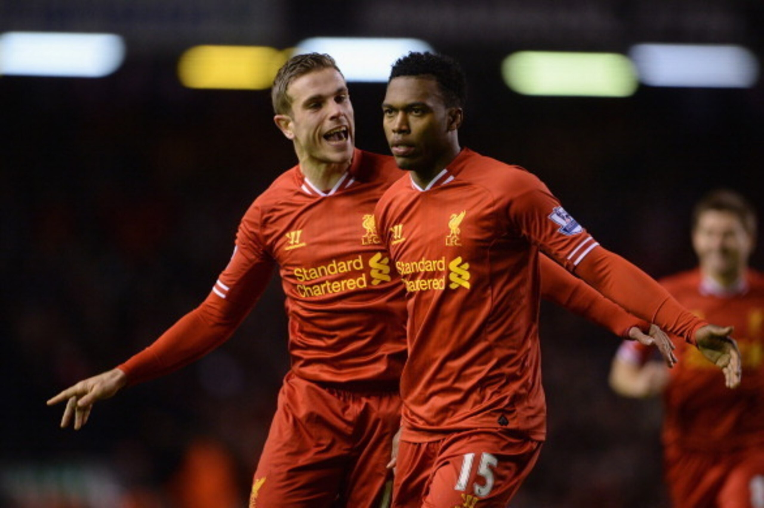 LIVERPOOL, ENGLAND - MARCH 26:  Daniel Sturridge of Liverpool celebrates scoring the second goal with team-mate Jordan Henderson (l) during the Barclays Premier League match between Liverpool and Sunderland at Anfield on March 26, 2014 in Liverpool, Engla
