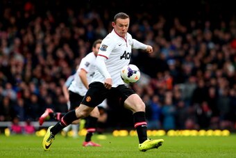 LONDON, ENGLAND - MARCH 22:  Wayne Rooney of Manchester United scores the opening goal with a long range shot during the Barclays Premier League match between West Ham United and Manchester United at Boleyn Ground on March 22, 2014 in London, England.  (P