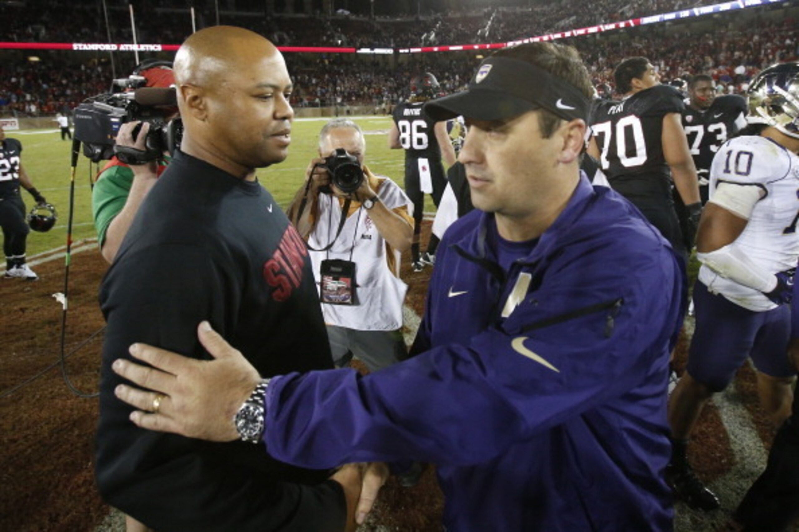 STANFORD, CA - OCTOBER 5: Head Coach David Shaw (L) of the Stanford Cardinal speaks with head coach Steve Sarkisian of the Washington Huskies after their game on October 5, 2013 at Stanford Stadium in Stanford, California. The Cardinal defeated the Huskie