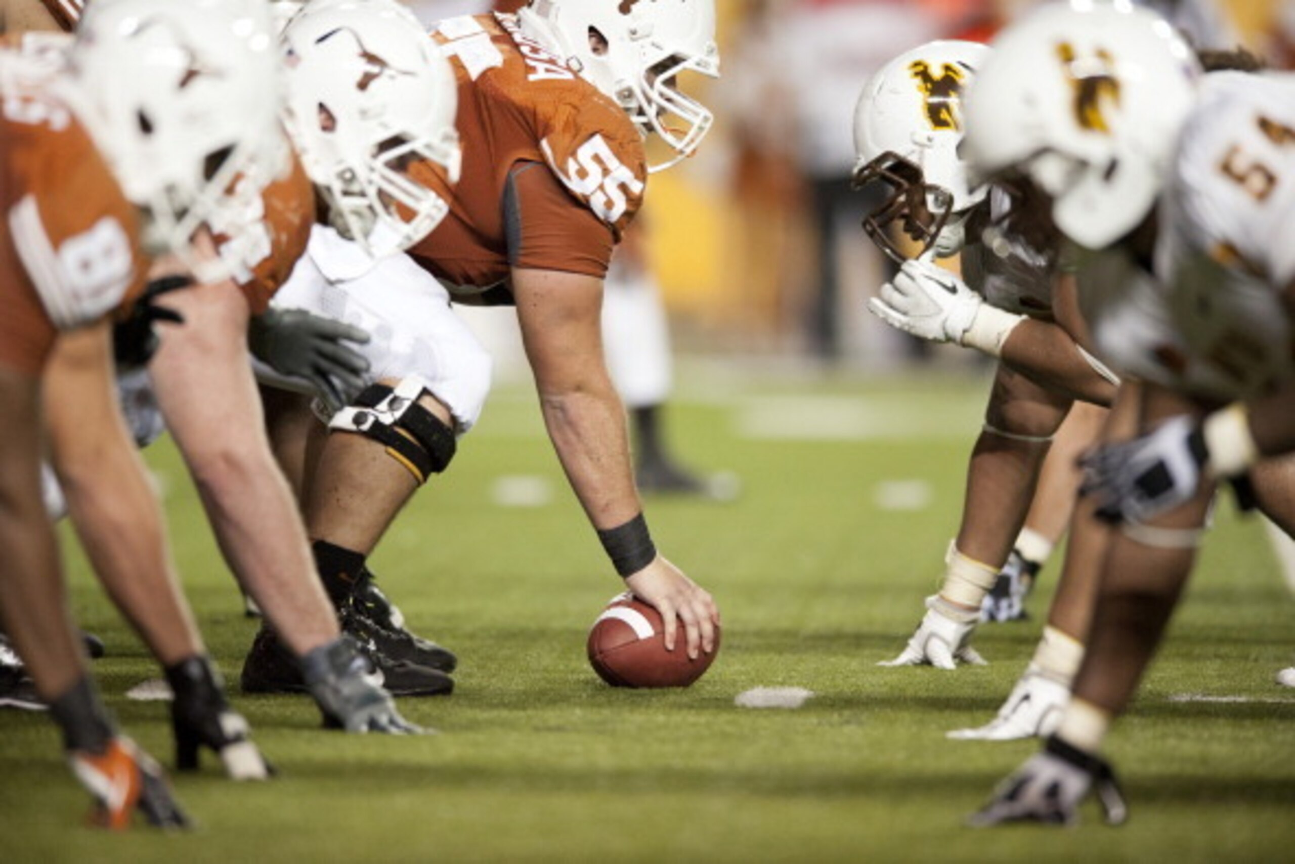 AUSTIN, TX - SEPTEMBER 1: Dominic Espinosa #55 of the Texas Longhorns lines up against the Wyoming Cowboy defense on September 1, 2012 at Darrell K Royal-Texas Memorial Stadium in Austin, Texas.  (Photo by Cooper Neill/Getty Images)