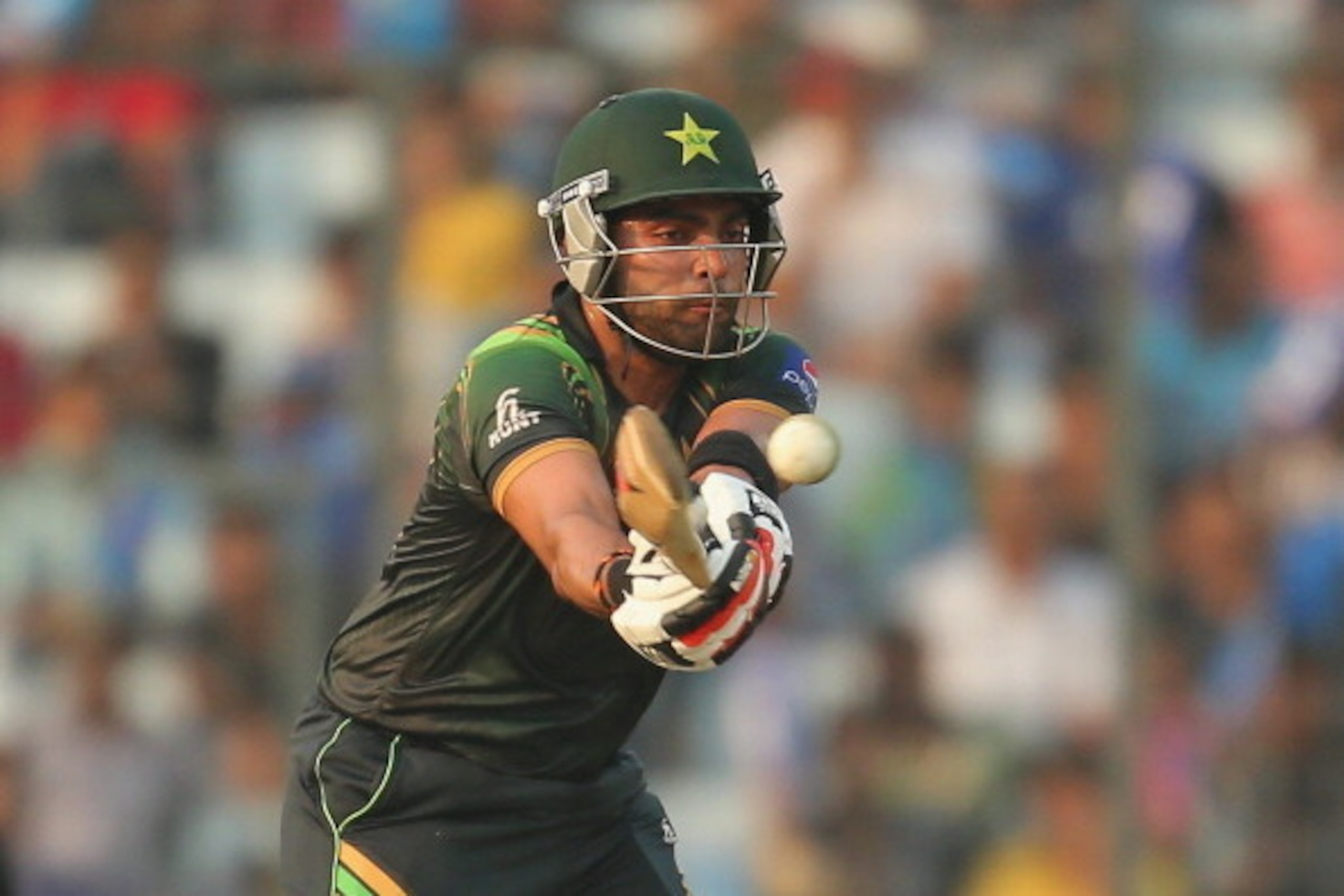 DHAKA, BANGLADESH - MARCH 23:  Umar Akmal of Pakistan bats during the ICC World Twenty20 Bangladesh 2014 match between Australia and Pakistan at Sher-e-Bangla Mirpur Stadium on March 23, 2014 in Dhaka, Bangladesh.  (Photo by Scott Barbour/Getty Images)