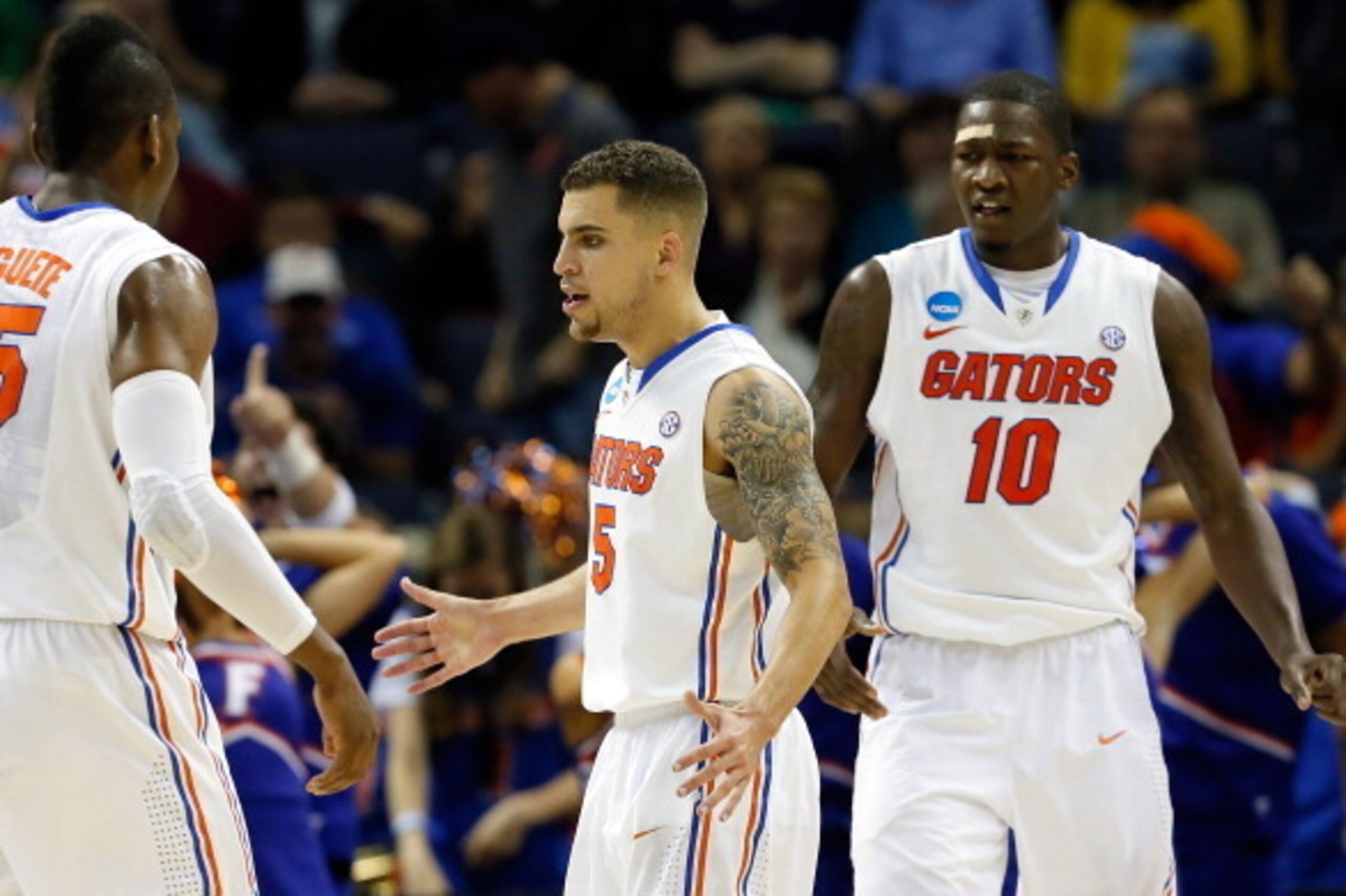 MEMPHIS, TN - MARCH 27: Scottie Wilbekin #5 of the Florida Gators celebrates against the UCLA Bruins during a regional semifinal of the 2014 NCAA Men's Basketball Tournament at the FedExForum on March 27, 2014 in Memphis, Tennessee. (Photo by Kevin C. C MEMPHIS, TN - MARCH 27: Scottie Wilbekin #5 of the Florida Gators celebrates against the UCLA Bruins during a regional semifinal of the 2014 NCAA Men's Basketball Tournament at the FedExForum on March 27, 2014 in Memphis, Tennessee. (Photo by Kevin C. C