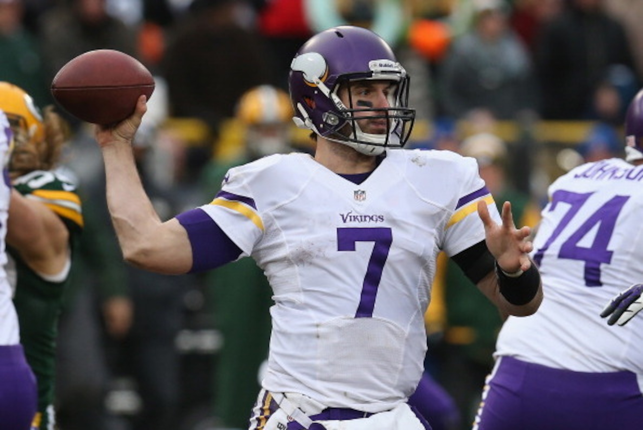 GREEN BAY, WI - NOVEMBER 24: Christian Ponder #7 of the Minnesota Vikings passes against the Green Bay Packers at Lambeau Field on November 24, 2013 in Green Bay, Wisconsin. The Vikings and the Packers tied 26-26 after overtime.  (Photo by Jonathan Daniel