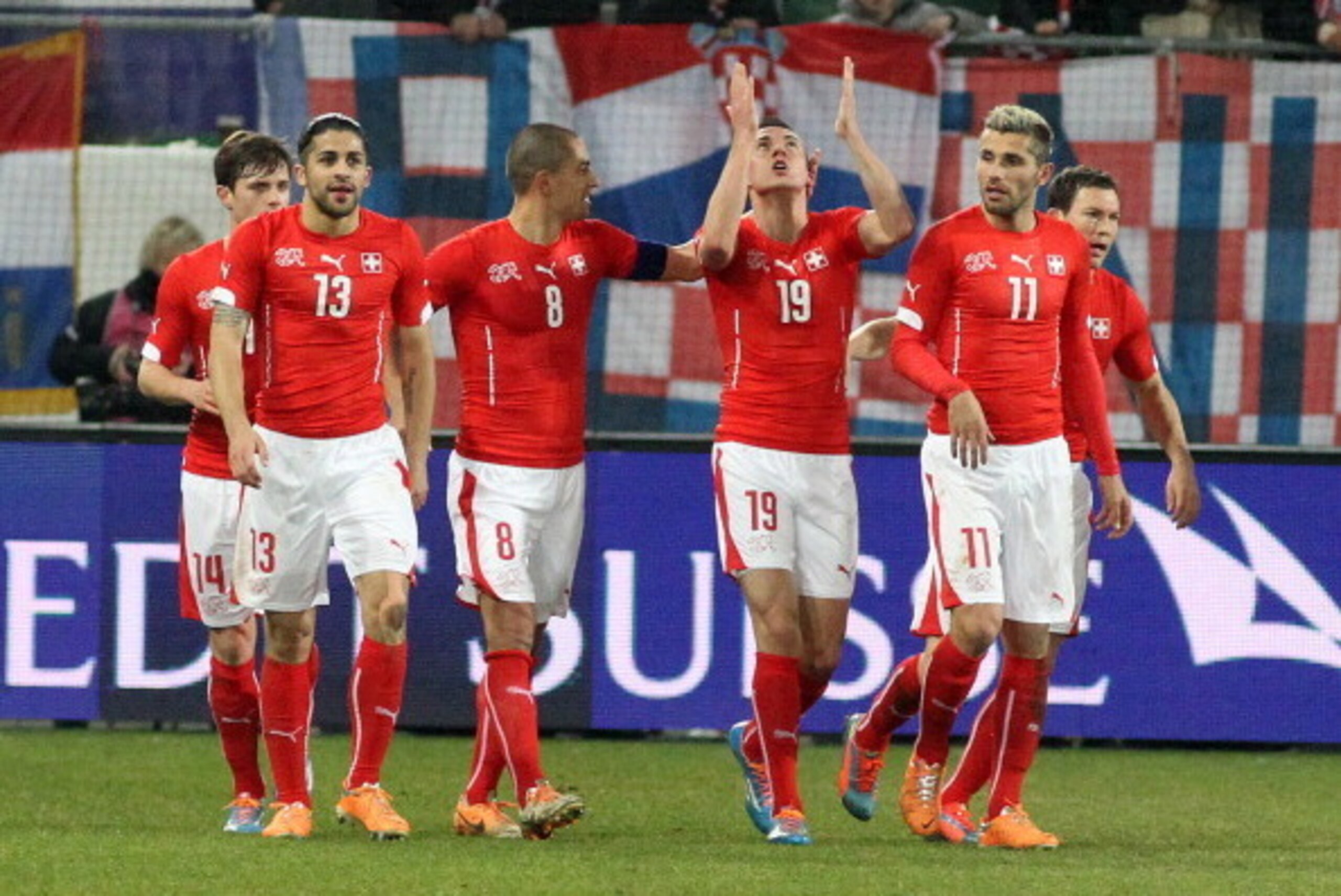 ST GALLEN, SWITZERLAND - MARCH 05: (L-R) Ricardo Rodriguez, Goekhan Inler, Josip Drmic and Valon Behrami of Switzerland celebrate the first goal of the match during the international friendly match between Switzerland and Croatia at the AFG Arena on March