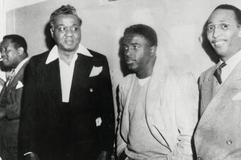 Jackie Robinson, center, with Karl Downs, right.