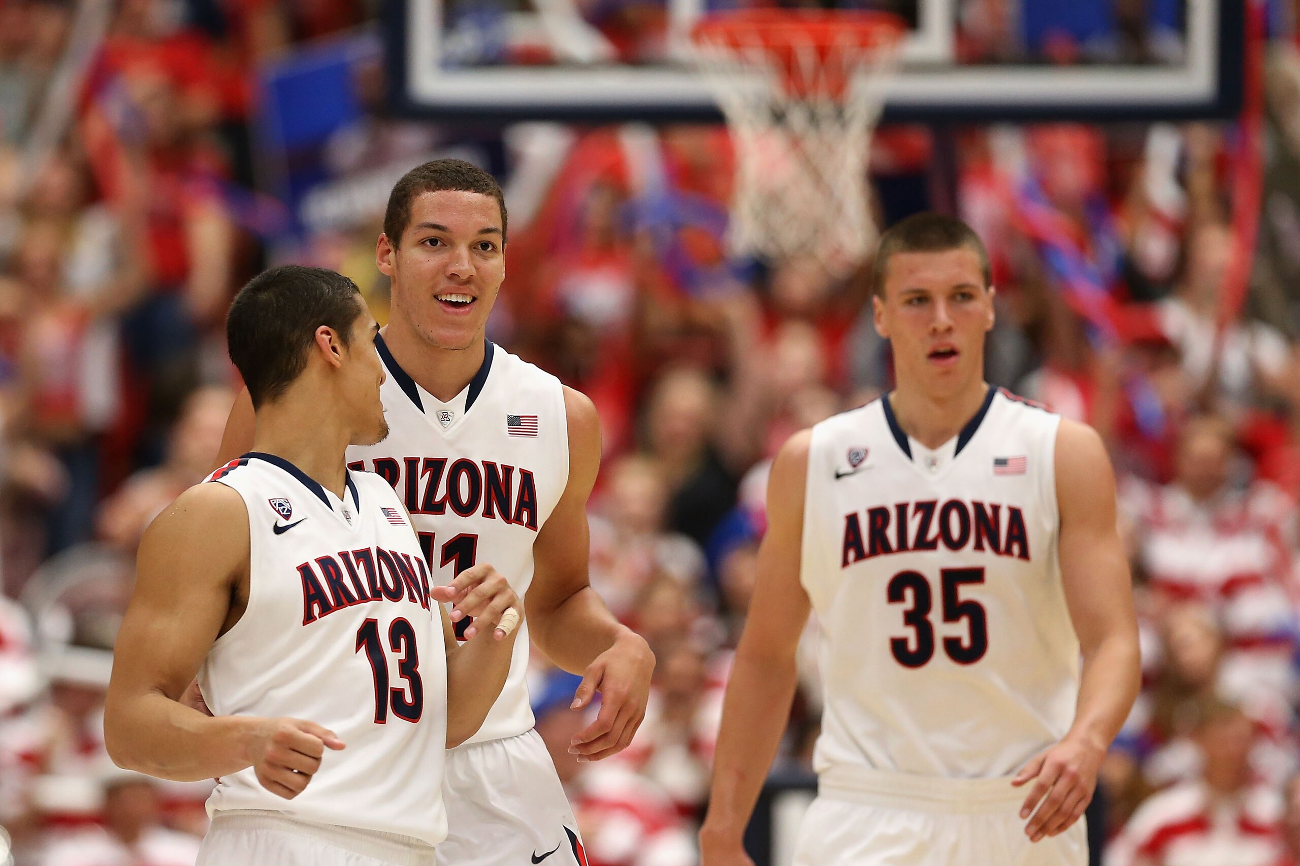 TUCSON, AZ - FEBRUARY 26:  (L-R) Nick Johnson #13, Aaron Gordon #11 and Kaleb Tarczewski #35 of the Arizona Wildcats react after scoring against the California Golden Bears during the second half of the college basketball game at McKale Center on February
