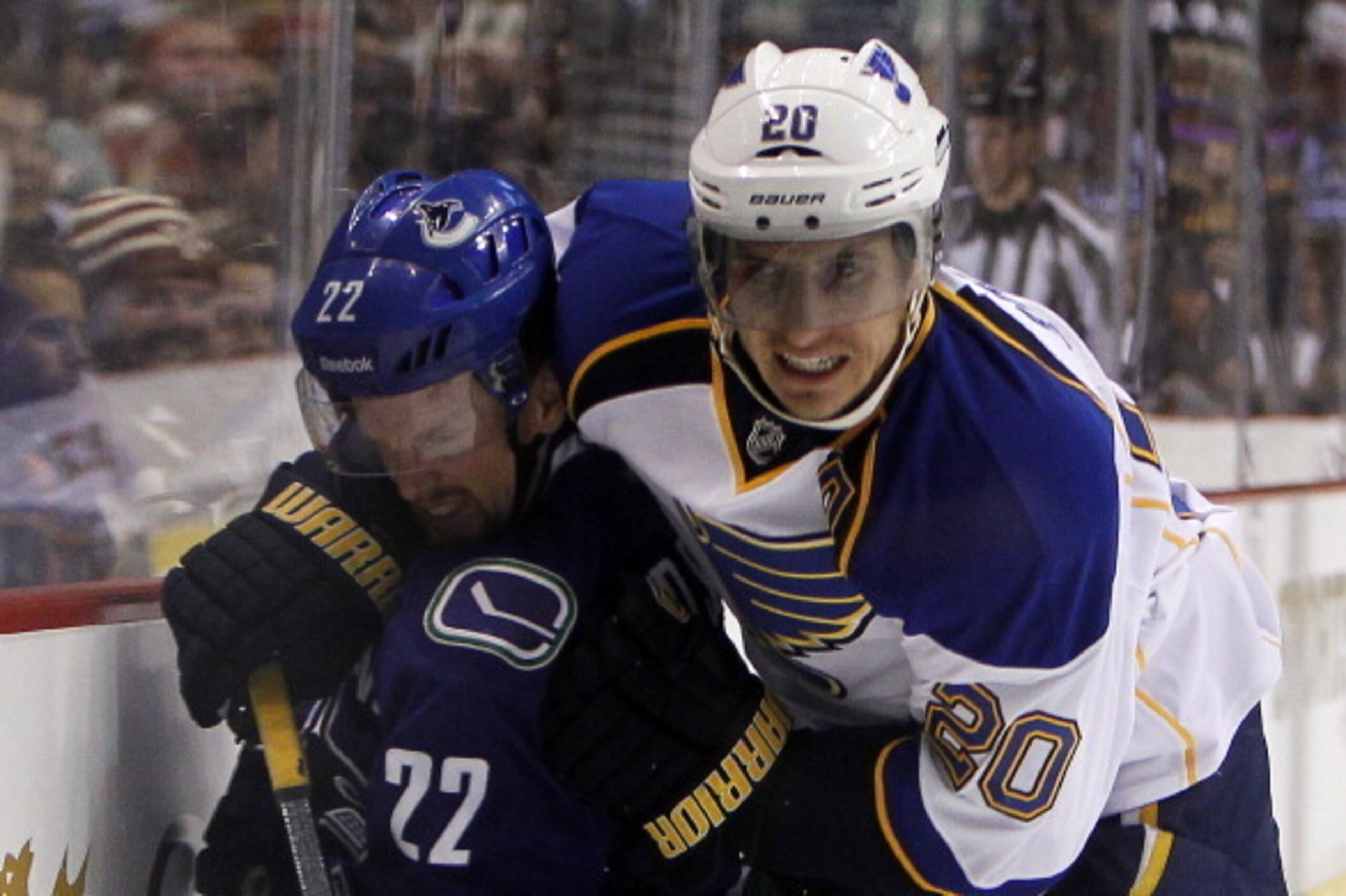 VANCOUVER, BC - FEBRUARY 26: Alex Steen #20 of the St. Louis Blues checks Daniel Sedin #22 of the Vancouver Canucks at Rogers Arena on February 26, 2014 in Vancouver, British Columbia, Canada. (Photo by Ben Nelms/Getty Images)