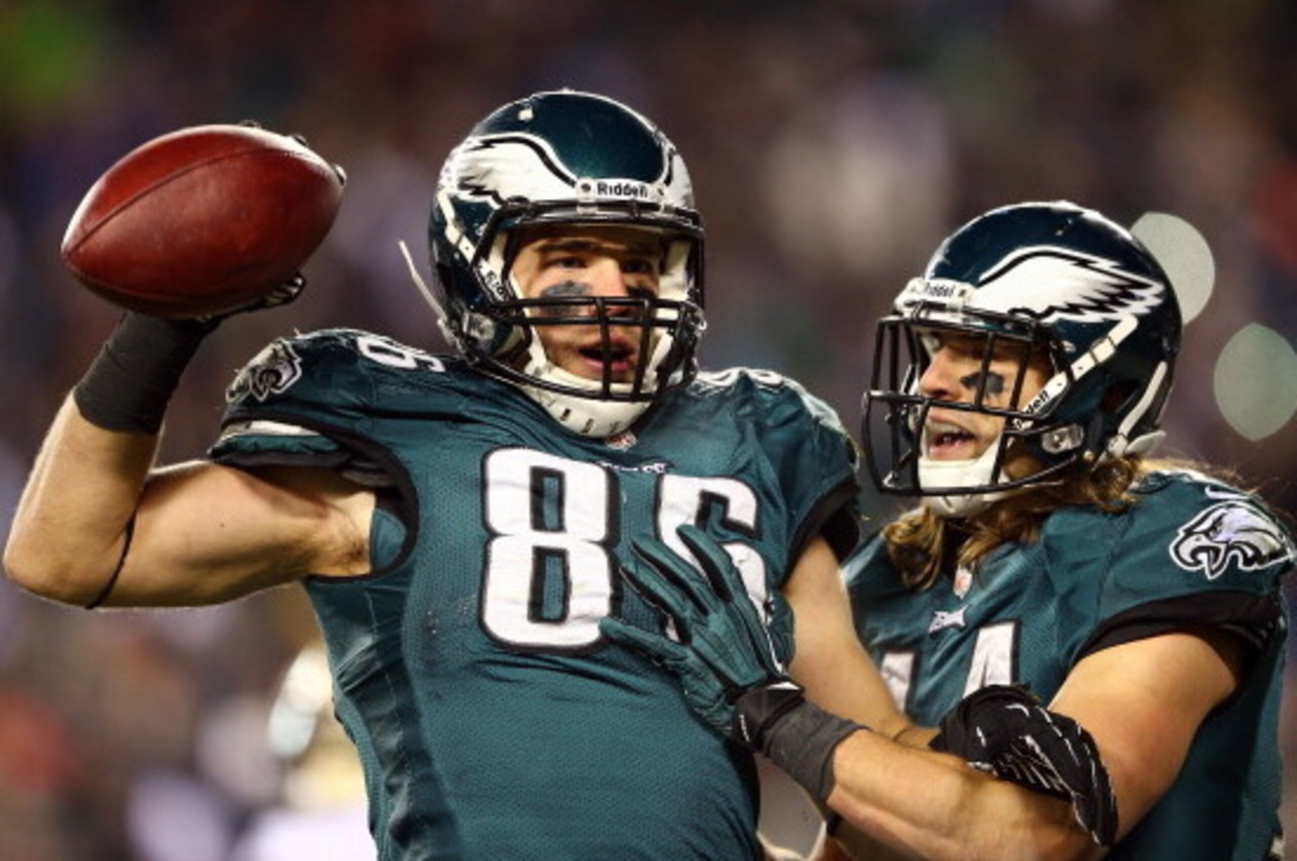 PHILADELPHIA, PA - JANUARY 04:  Zach Ertz #86 of the Philadelphia Eagles celebrates with teammate Riley Cooper #14 after scoring a 3 yard touchdown pass from Nick Foles #9 in the fourth quarter against the New Orleans Saints to take the lead 24-23 during 