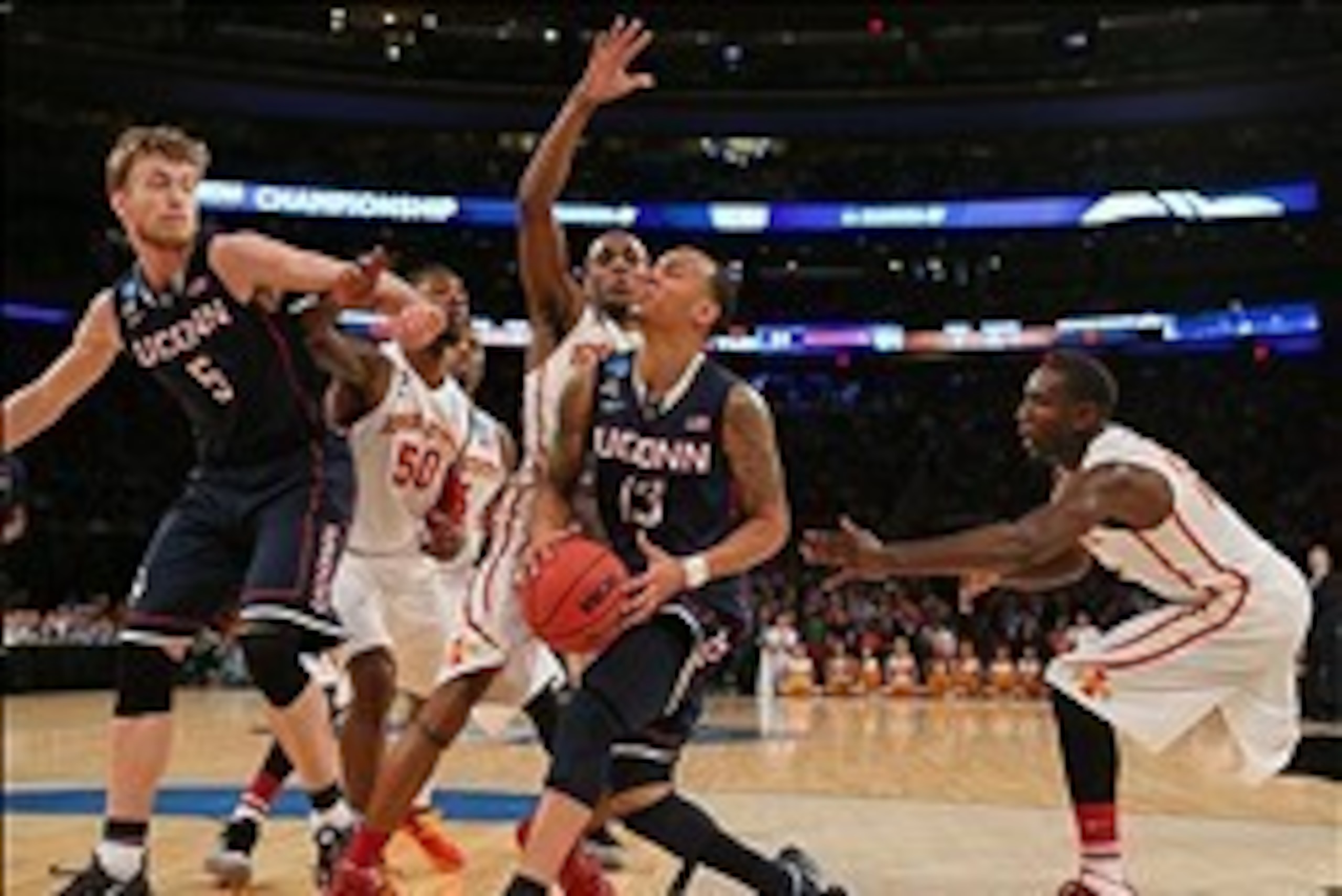 Mar 28, 2014; New York, NY, USA; Connecticut Huskies guard Shabazz Napier (13) shoots the ball against Iowa State Cyclones forward Jameel McKay (13) during the second half in the semifinals of the east regional of the 2014 NCAA Mens Basketball Championshi