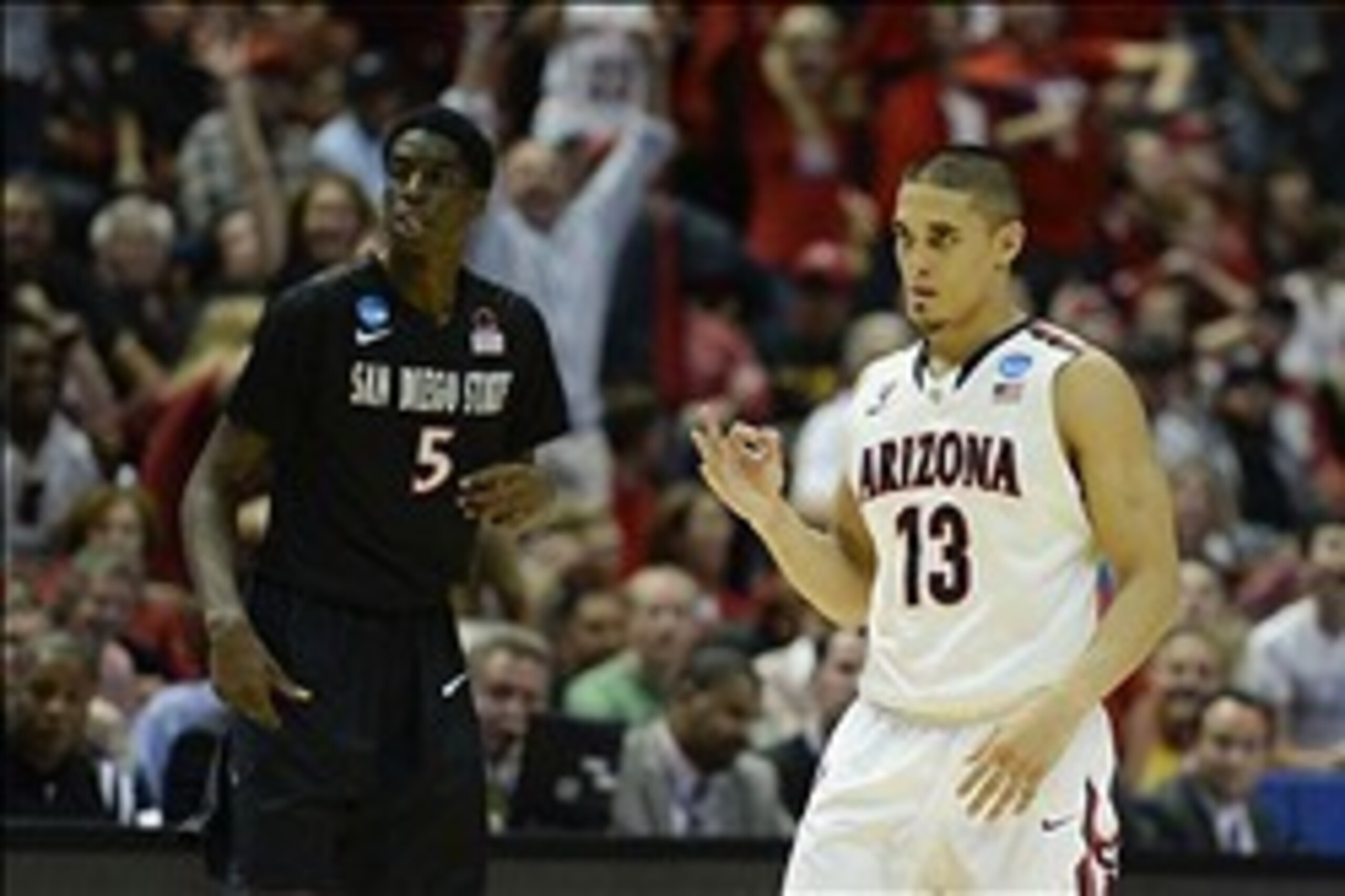 Mar 27, 2014; Anaheim, CA, USA; (Editor's Note: Caption Correction) Arizona Wildcats guard Nick Johnson (13) celebrates against San Diego State Aztecs forward Dwayne Polee II (5) during the second half in the semifinals of the west regional of the 2014 NC Mar 27, 2014; Anaheim, CA, USA; (Editor's Note: Caption Correction) Arizona Wildcats guard Nick Johnson (13) celebrates against San Diego State Aztecs forward Dwayne Polee II (5) during the second half in the semifinals of the west regional of the 2014 NC