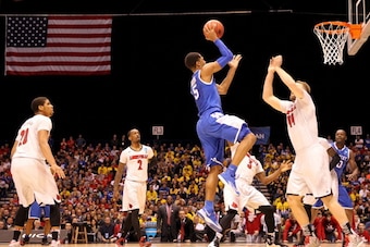 INDIANAPOLIS, IN - MARCH 28:  Andrew Harrison #5 of the Kentucky Wildcats shoots the ball against the Louisville Cardinals during the regional semifinal of the 2014 NCAA Men's Basketball Tournament at Lucas Oil Stadium on March 28, 2014 in Indianapolis, I
