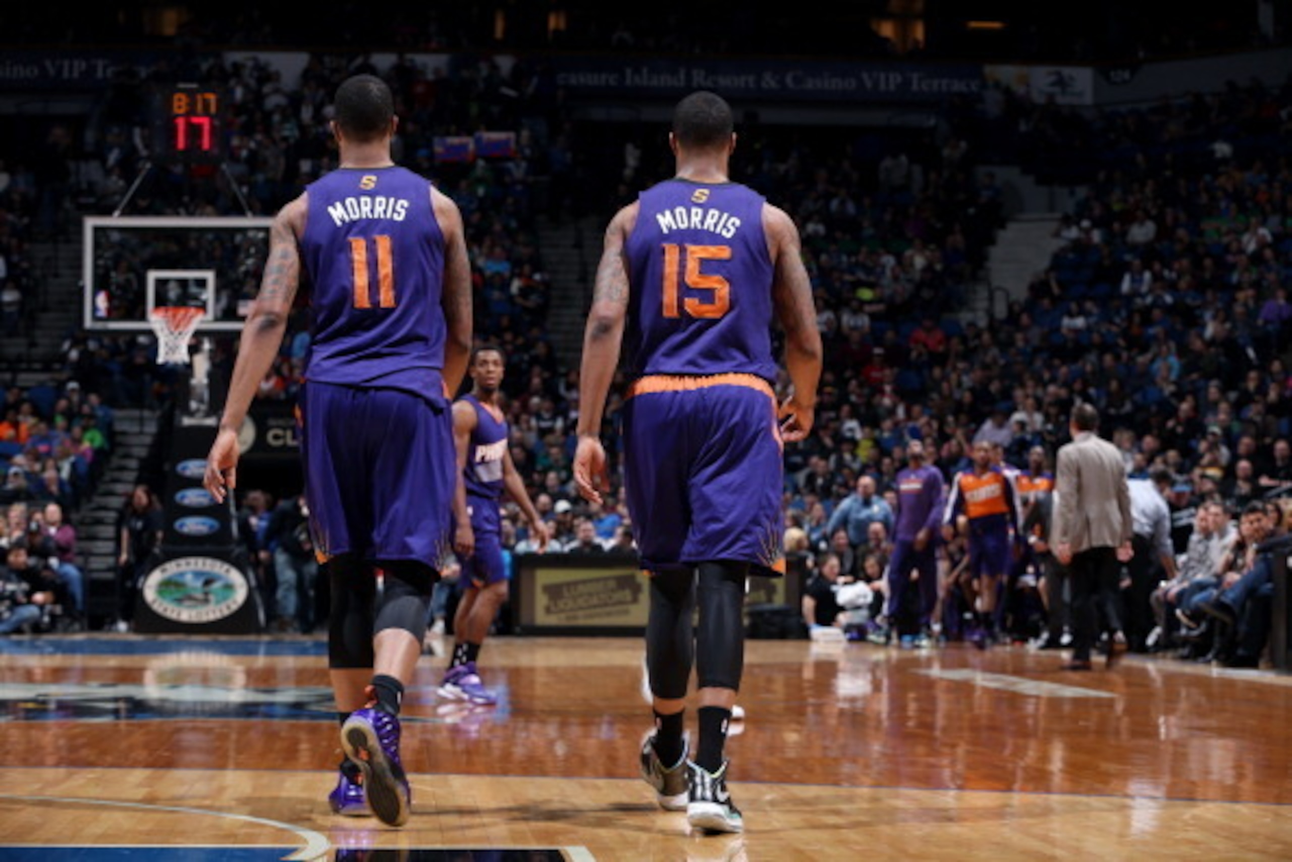 MINNEAPOLIS, MN - MARCH 23: Markieff Morris #11 and Marcus Morris #15 of the Phoenix Suns walk down the court during a game against the Minnesota Timberwolves on March 23, 2014 at Target Center in Minneapolis, Minnesota. NOTE TO USER: User expressly ackno