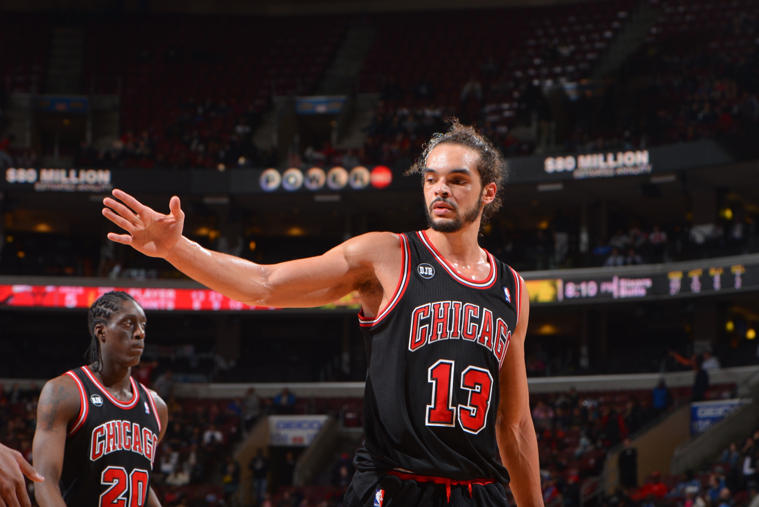 PHILADELPHIA, PA - MARCH 19: Joakim Noah #13 of the Chicago Bulls congradulates a teammate against the Philadelphia 76ers at the Wells Fargo Center on March 19, 2014 in Philadelphia, Pennsylvania. NOTE TO USER: User expressly acknowledges and agrees that,
