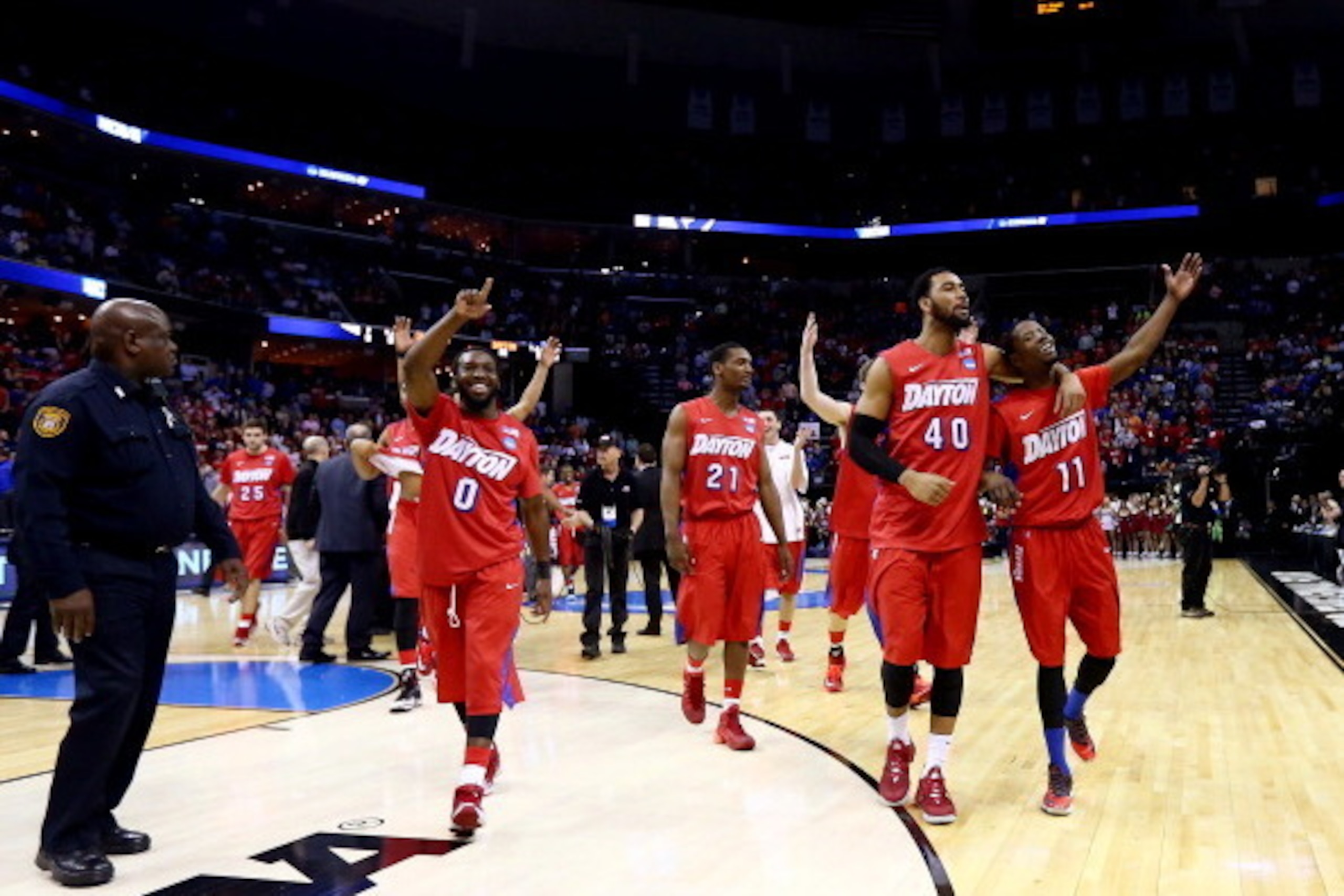 MEMPHIS, TN - MARCH 27:  The Dayton Flyers walk off the floor after defeating the Stanford Cardinal 82-72 in a regional semifinal of the 2014 NCAA Men's Basketball Tournament at the FedExForum on March 27, 2014 in Memphis, Tennessee.  (Photo by Streeter L