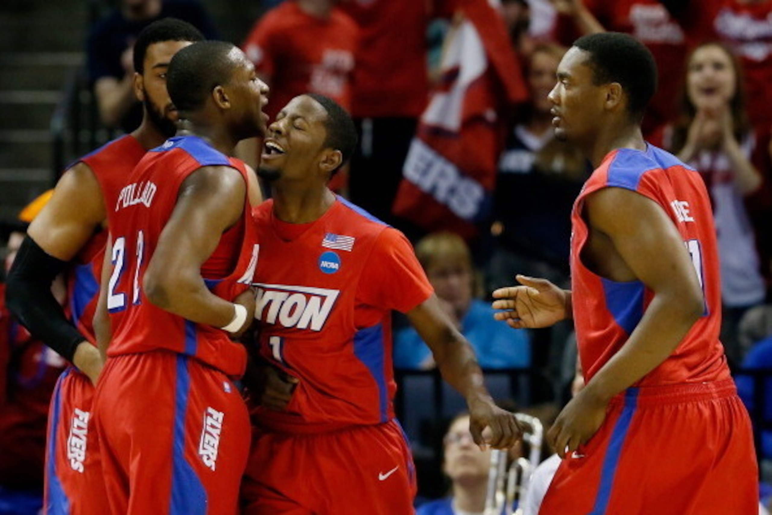 MEMPHIS, TN - MARCH 27:  Kendall Pollard #22 celebrates with Scoochie Smith #11 of the Dayton Flyers against the Stanford Cardinal during a regional semifinal of the 2014 NCAA Men's Basketball Tournament at the FedExForum on March 27, 2014 in Memphis, Ten
