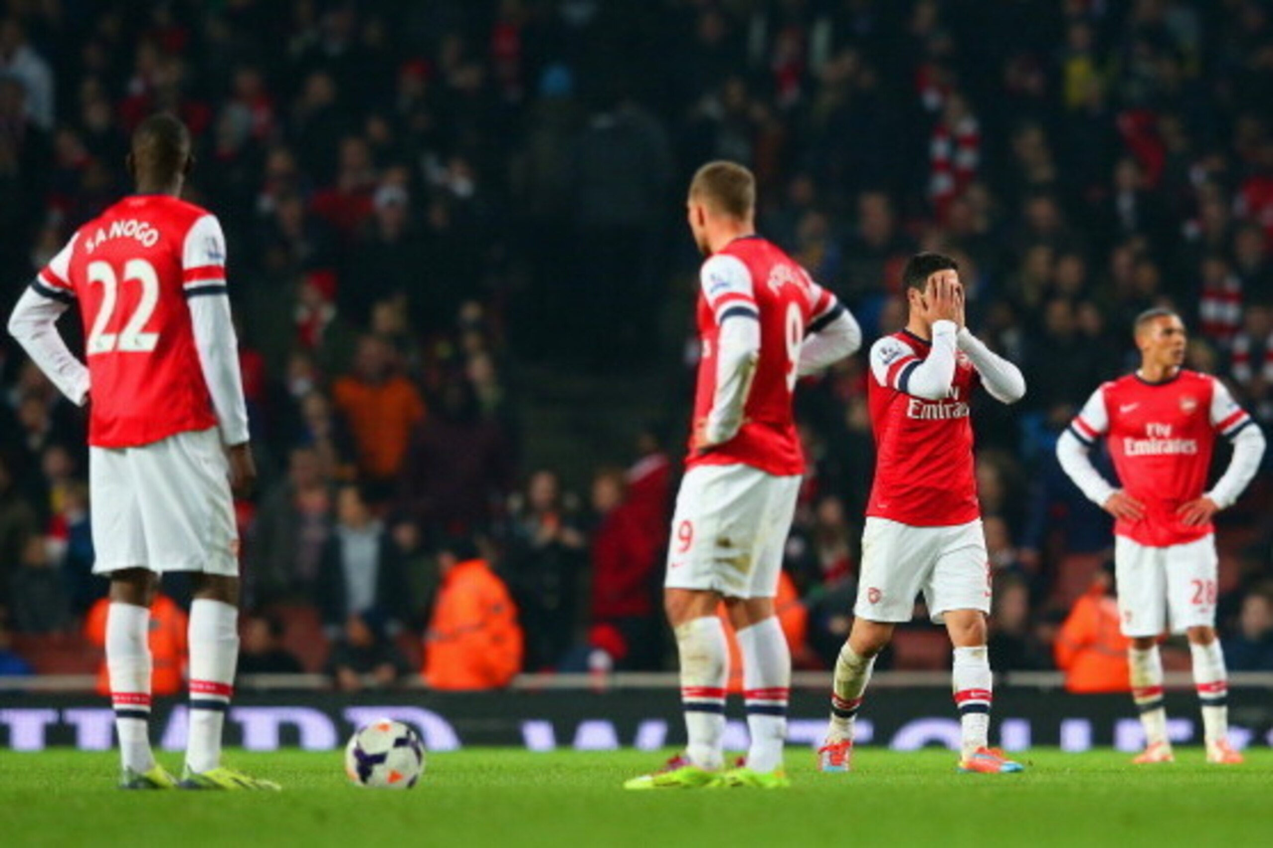 LONDON, ENGLAND - MARCH 25:  A dejected Mikel Arteta of Arsenal holds his head in his hands after Mathieu Flamini of Arsenal (not pictured) scored an own goal in the final minutes during the Barclays Premier League match between Arsenal and Swansea City a