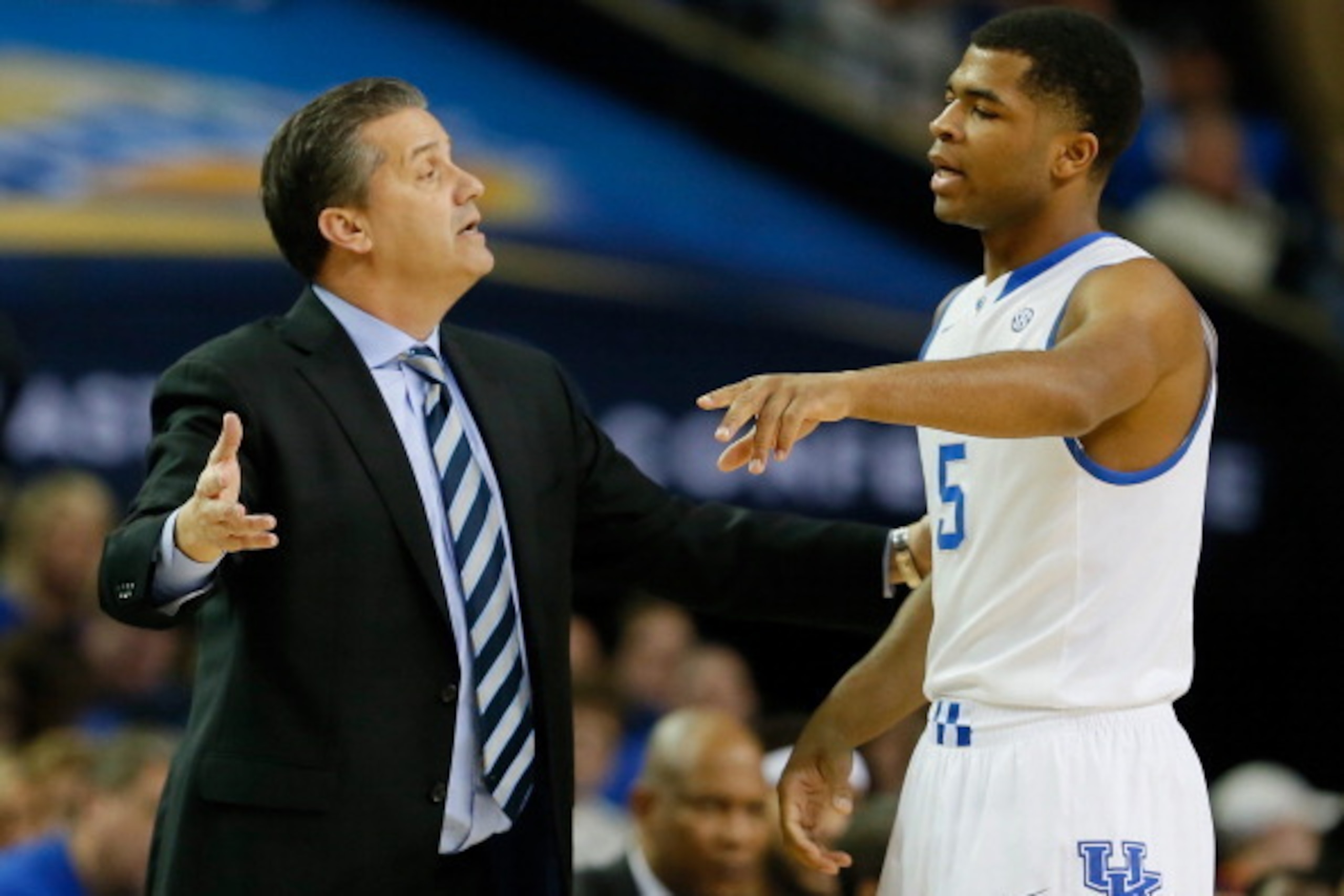 ATLANTA, GA - MARCH 14:  Head coach John Calipari of the Kentucky Wildcats converses with Andrew Harrison #5 against the LSU Tigers during the quarterfinals of the SEC Men's Basketball Tournament at Georgia Dome on March 14, 2014 in Atlanta, Georgia.  (Ph