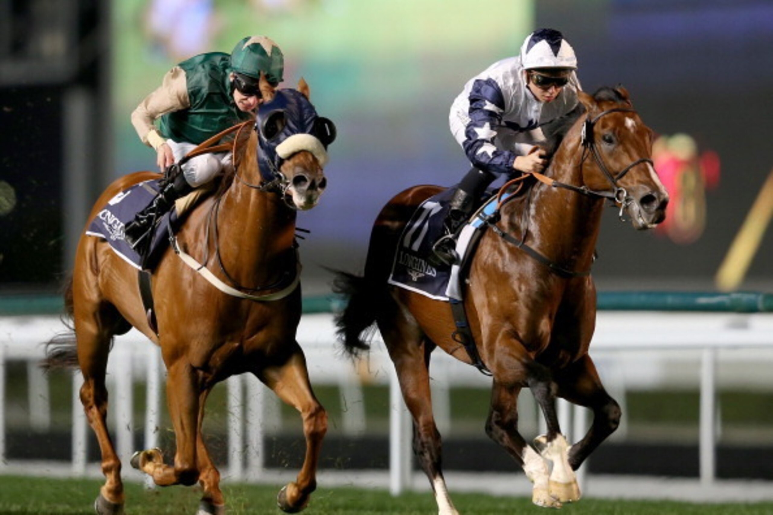 DUBAI, UNITED ARAB EMIRATES - JANUARY 09:  Mickael Barzalona riding Ahtoug (R) wins Race 2, Longines Master Collection during the first Longines Carnival Meeting at the Meydan Racecourse on January 9, 2014 in Dubai, United Arab Emirates.  (Photo by Franco