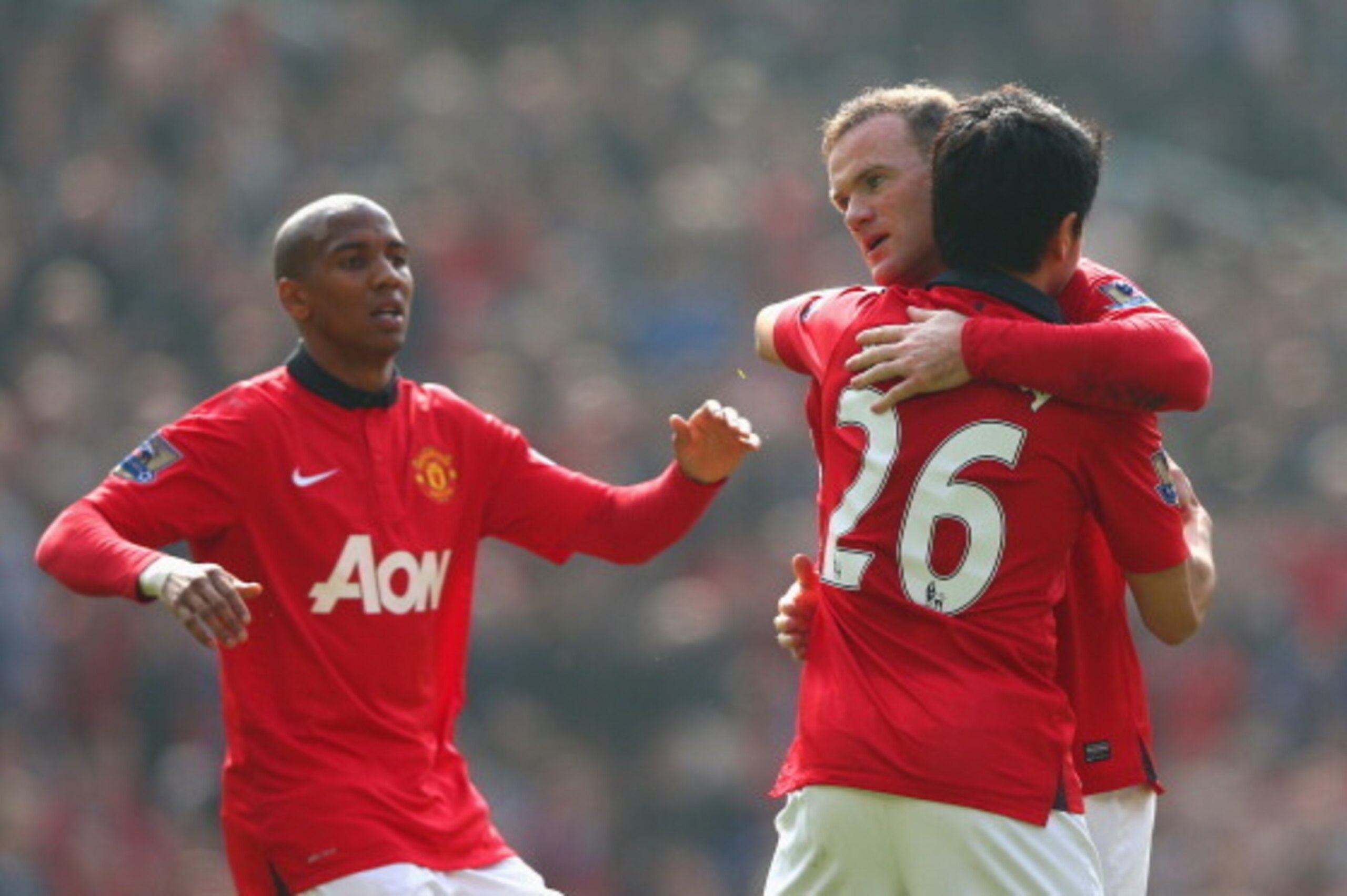 MANCHESTER, ENGLAND - MARCH 29:  Wayne Rooney of Manchester United celebrates scoring his team's first goal with Shinji Kagawa during the Barclays Premier League match between Manchester United and Aston Villa at Old Trafford on March 29, 2014 in Manchest