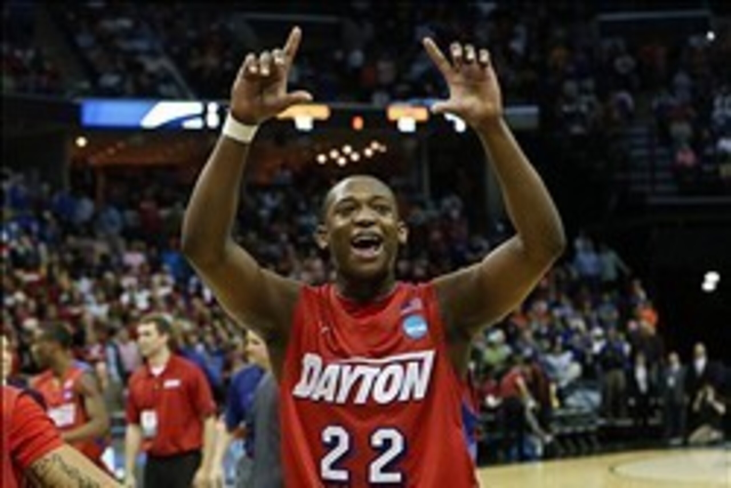 Mar 27, 2014; Memphis, TN, USA; Dayton Flyers forward Kendall Pollard (22) celebrates after defeating the Stanford Cardinal 82-72 in the semifinals of the south regional of the 2014 NCAA Mens Basketball Championship tournament at FedExForum. Mandatory Cre