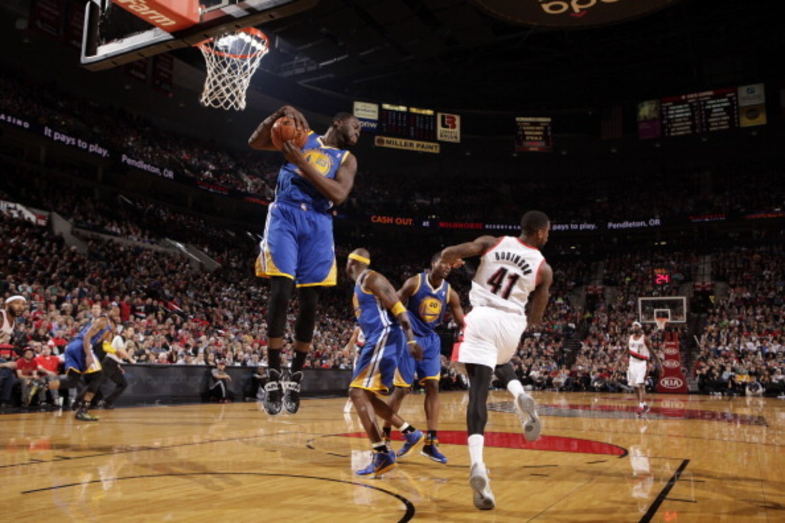 PORTLAND, OR - MARCH 16: Draymond Green #23 of the Golden State Warriors grabs a rebound against the Portland Trail Blazers on March 16, 2014 at the Moda Center Arena in Portland, Oregon. NOTE TO USER: User expressly acknowledges and agrees that, by downl