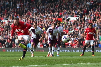 MANCHESTER, ENGLAND - MARCH 29:  Wayne Rooney of Manchester United scores his team's second goal from a penalty kick during the Barclays Premier League match between Manchester United and Aston Villa at Old Trafford on March 29, 2014 in Manchester, Englan